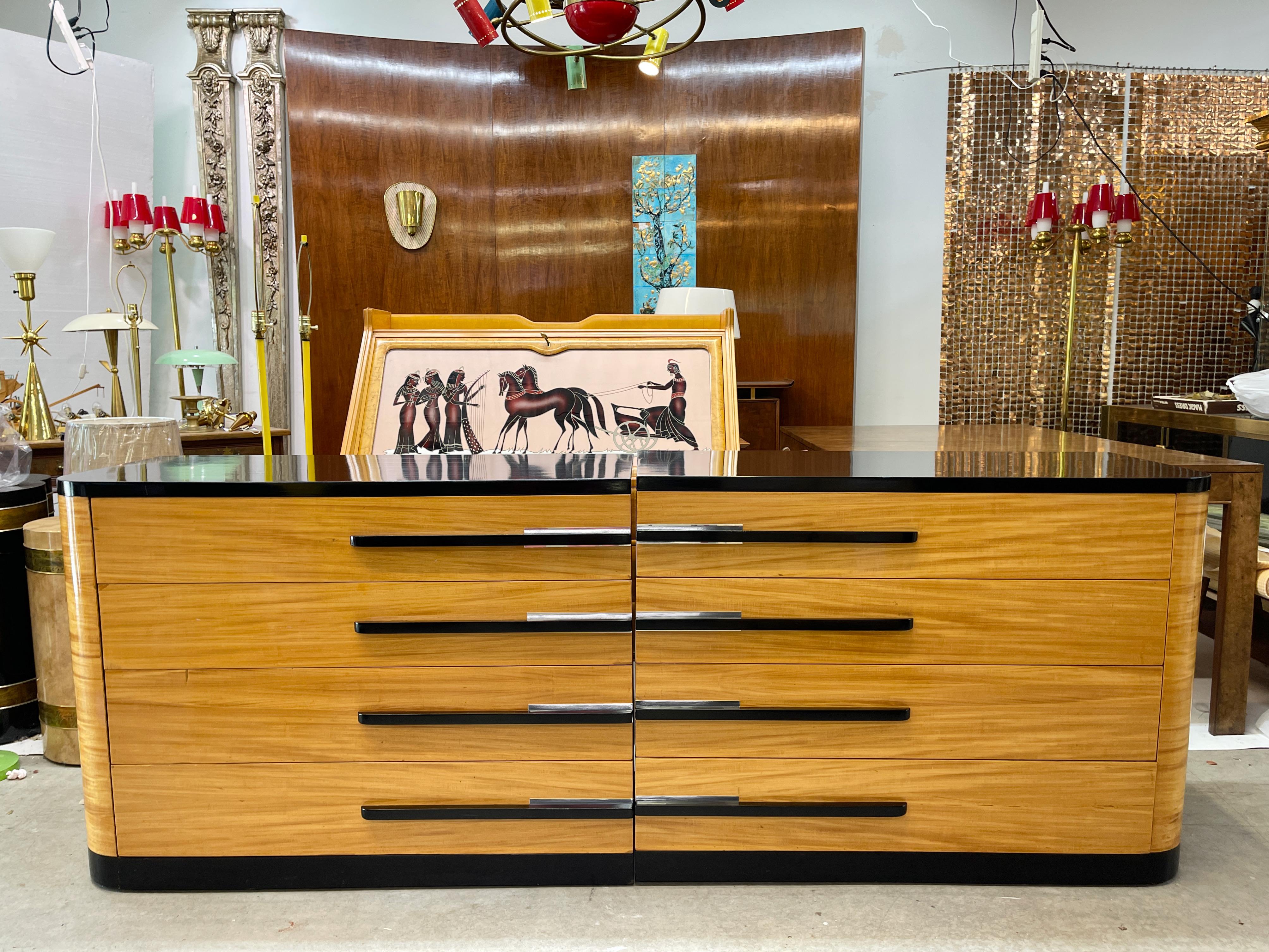 Pair of 1938 vintage American Modern streamline art deco chests of drawers designed by Leo Jiranek and possibly manufactured by J.B. Van Sciver Co. of Camden, NJ. Unsigned.
The design is bookended as each chest has a corresponding rounded vertical