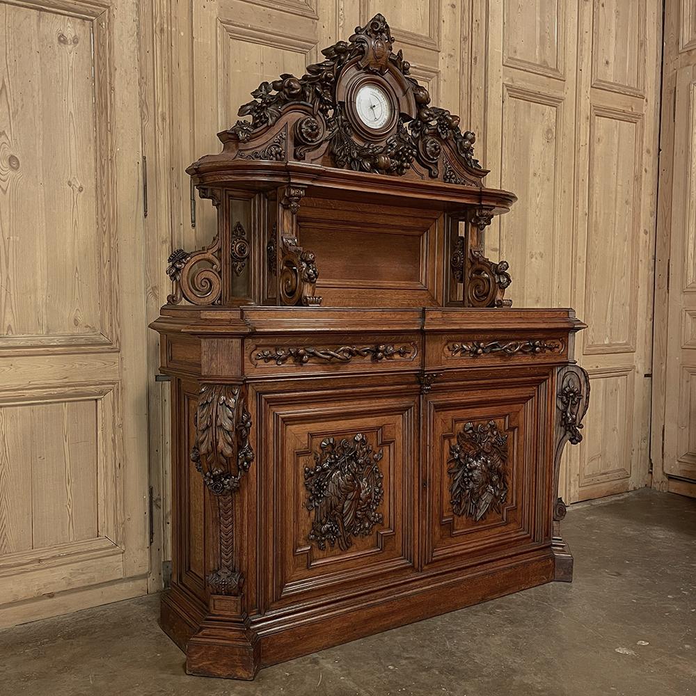 Pair Stunning French Renaissance Revival Sculpted Buffets are monuments to the furniture maker's art! Commissioned for a lovely chateau, each is captivating in its uniqueness. The scientific instruments embedded in the lavish carved crowns above the