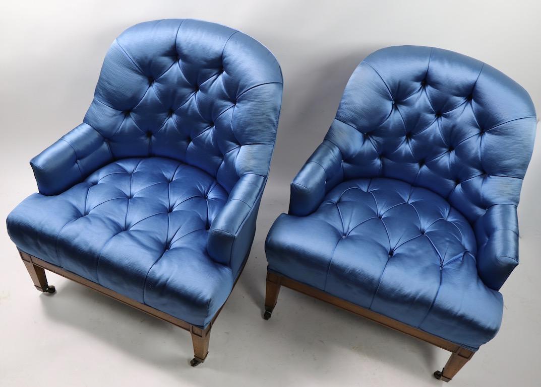 High style midcentury side, lounge, or slipper chairs in glamour’s blue satin fabric. Both are in very good, clean and ready to condition.
Measures: Total H 31 x arm H 20 x seat H 14.
Offered and priced as a pair.
   