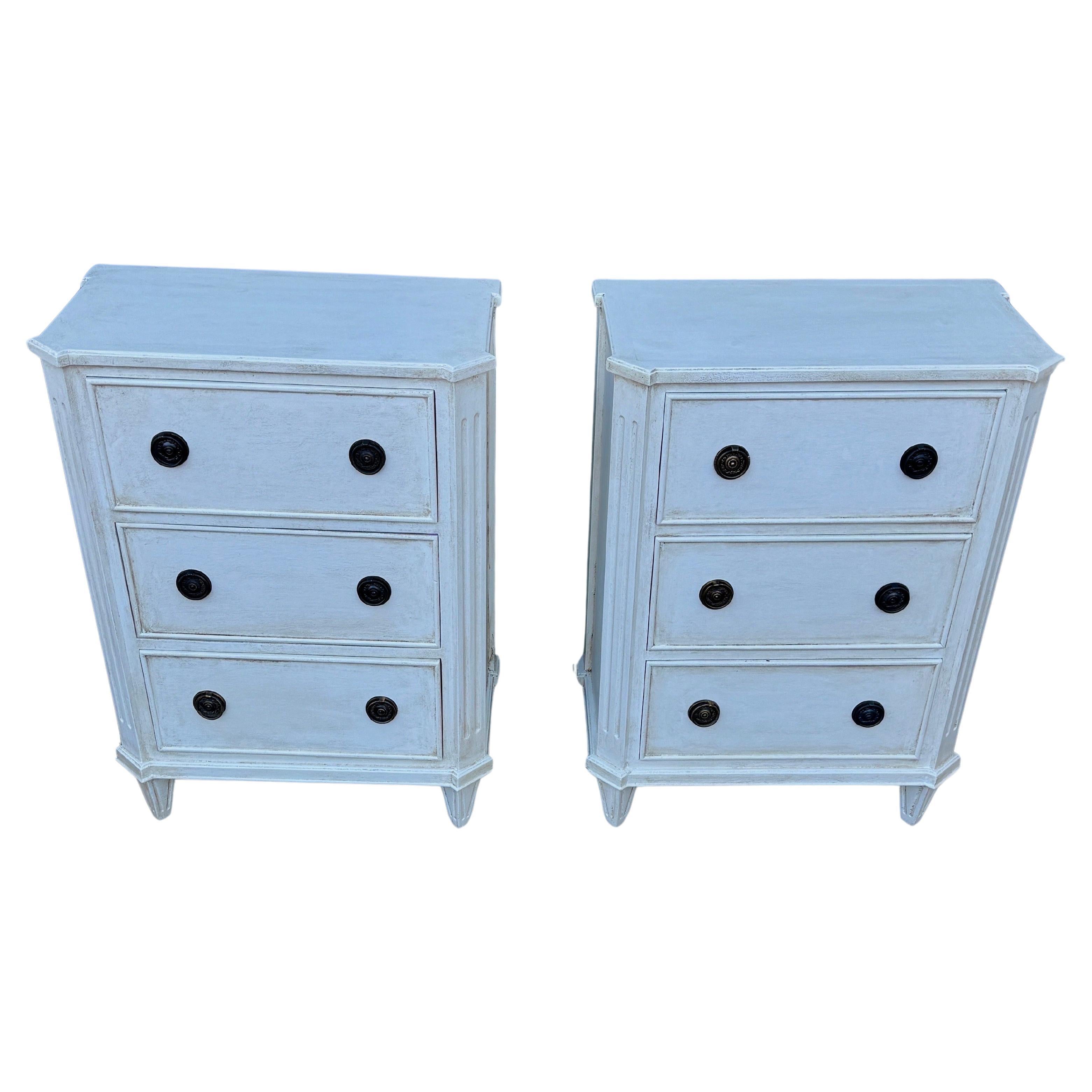 Painted Gustavian Style Chest of Drawers or Side Tables, A Pair 

These classic Swedish style three drawer hand painted chests, small commodes or end tables have been constructed from solid wood with a hand-applied distressed finish and feature