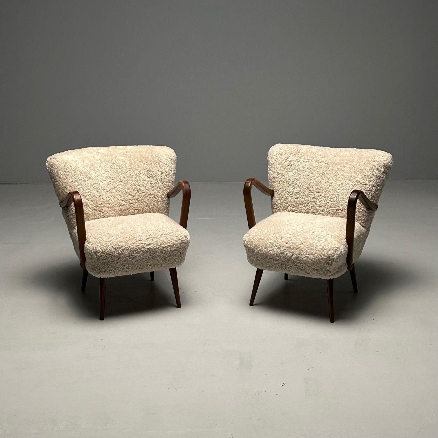 Pair Swedish Mid-Century Modern Sheepskin Arm / Lounge Chairs, Petite, Shearling
 
Chic set of two modern arm, lounge, or occasional chairs designed and produced in Sweden circa 1950s. Each example has been newly upholstered in a luxurious 17 mm