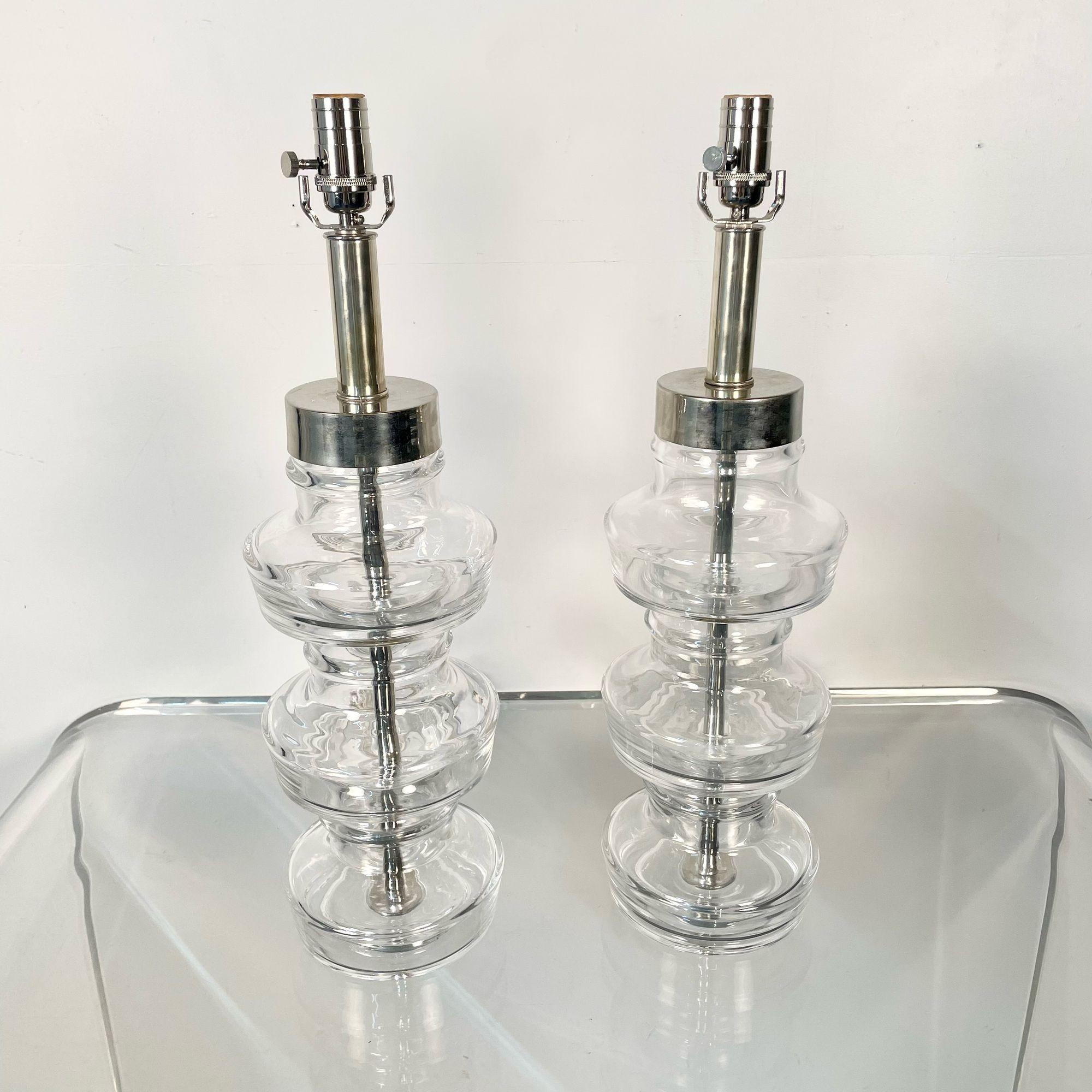 Pair Swedish Mid-Century Modern Translucent Clear Glass Table or Desk Lamps

A pair of clear glass lamps with polished nickel hardware by Carl Fagerlund for Orrefors, Swedish C. 1960's

Glass, Nickel
Sweden, c. 1960s

24.5