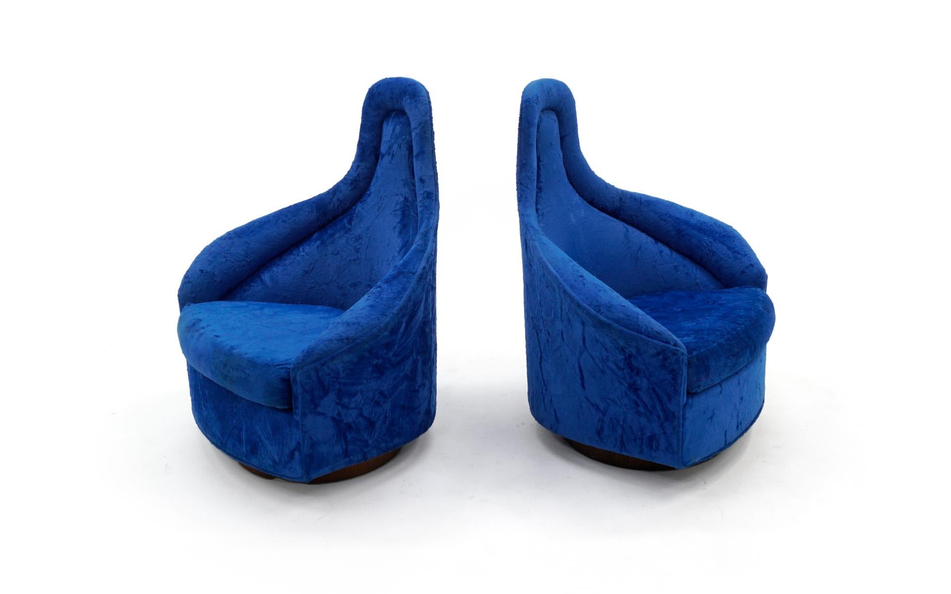 Pair of high back swivel lounge chairs designed by Adrian Pearsall for Craft Associates. These are in the original custom ordered blue crushed velvet. This was not a stock upholstery job, but a special order from Craft Associates by the original