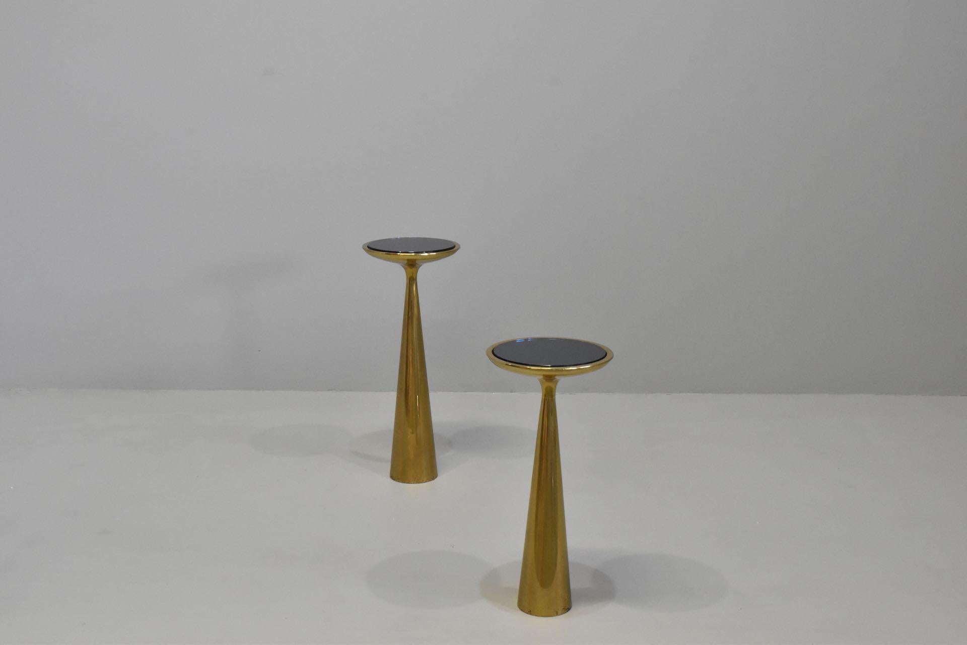 Rare Pair coffee table mod.1176 designed by Max Ingrand for Fontana Arte in the 1960s. Conical base with flaring and top edged in brass which houses a crystal with a mirrored blueground. The object shows very slight signs of use but overall it is in
