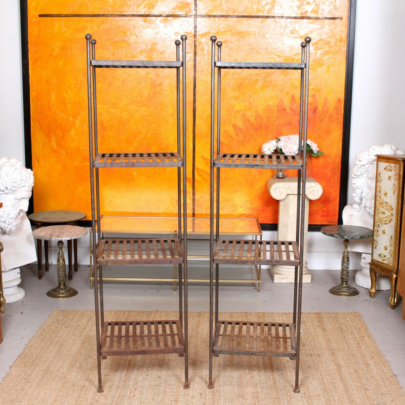A pair of Fine mid-20th century French wrought iron étagères.

With a lovely worn patina the slatted shelves raised on slender supports with ball finials and feet,

France, circa 1950.