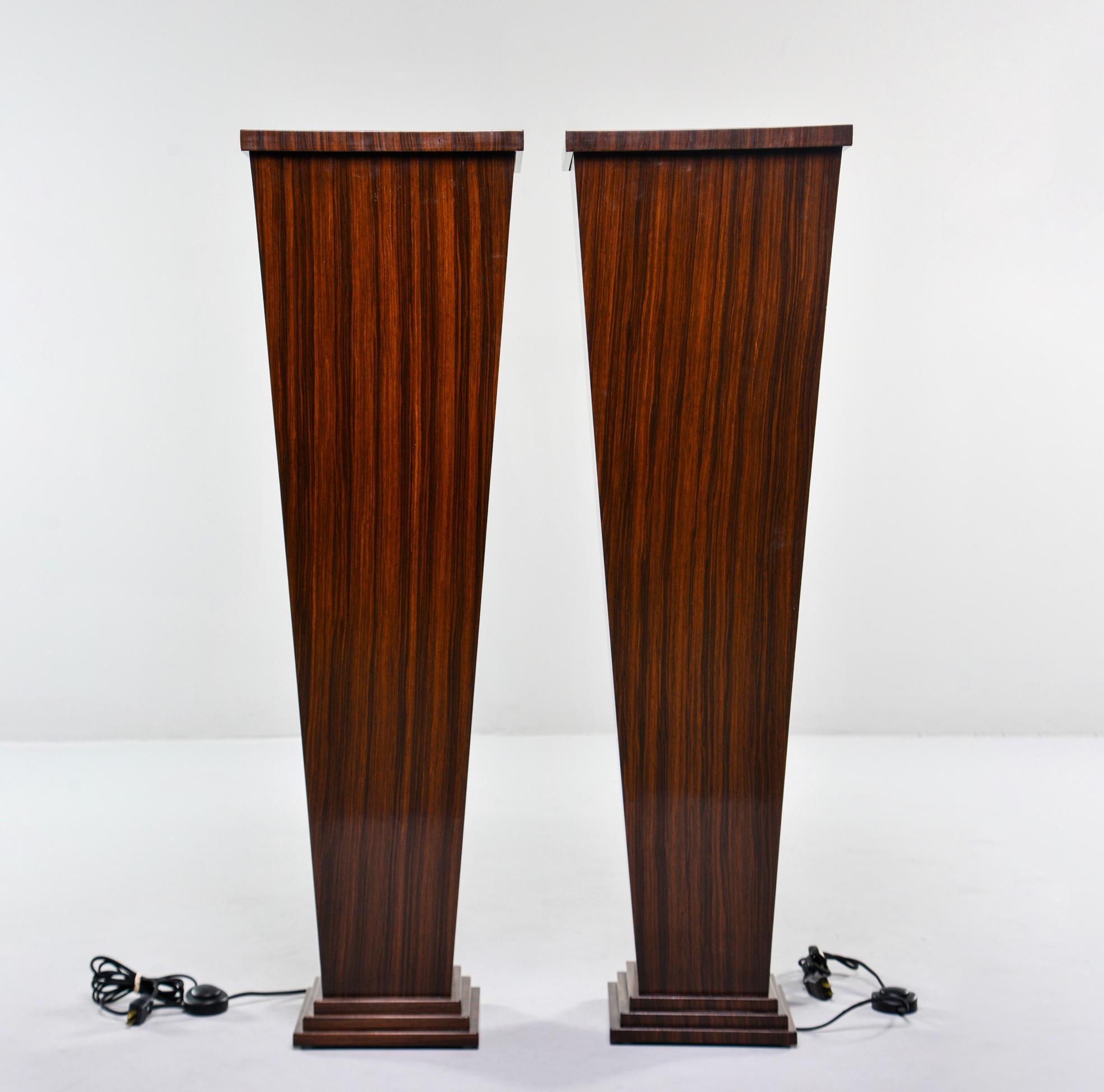 Custom made for us in England, this pair of tall display stands feature richly figured walnut veneers with an interior standard-sized light socket and glass inserts at top so that displays can be lit from underneath. Great for displaying art glass