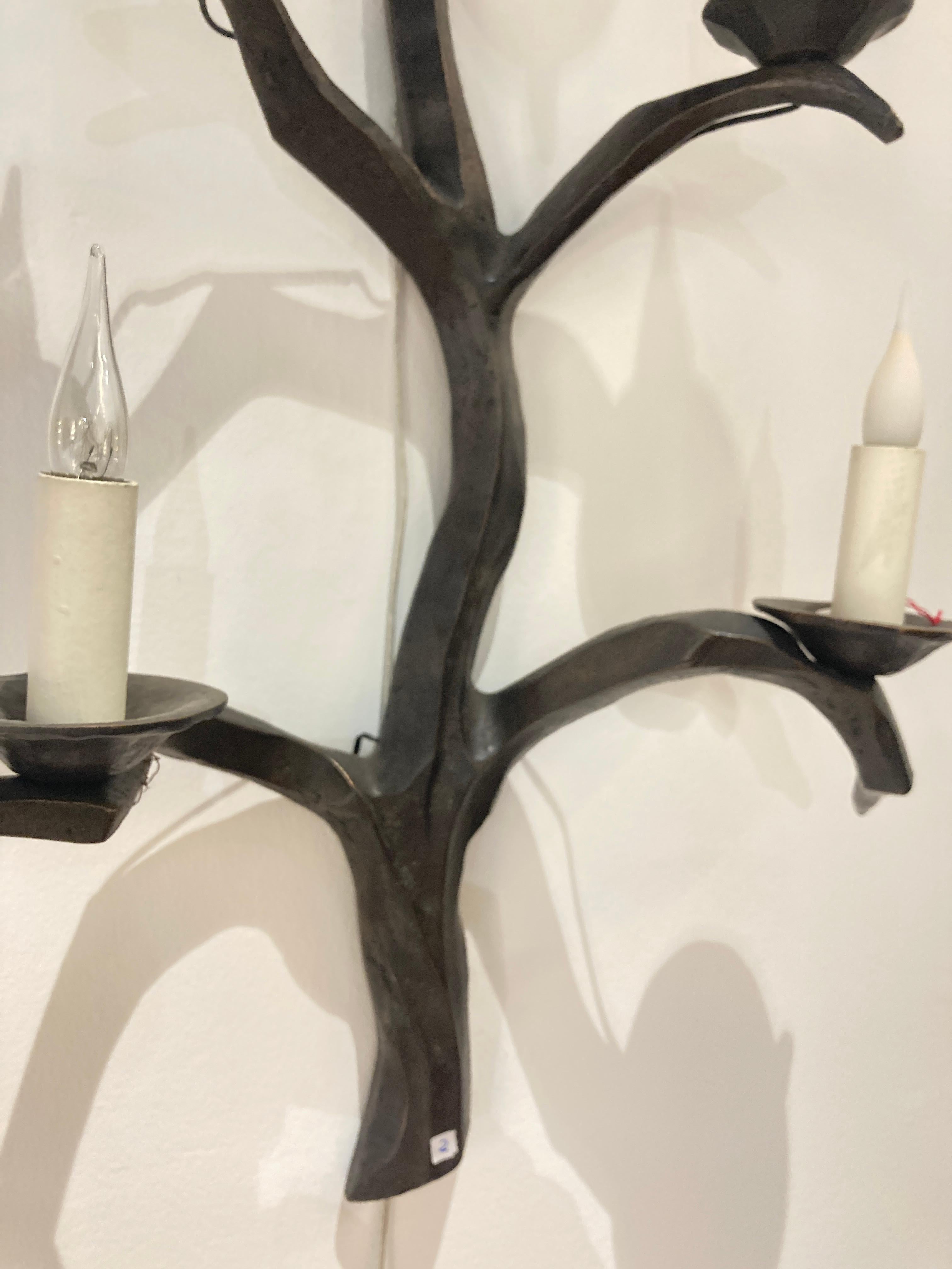 French Pair tall bronze sconces in the style of Felix Agostini For Sale