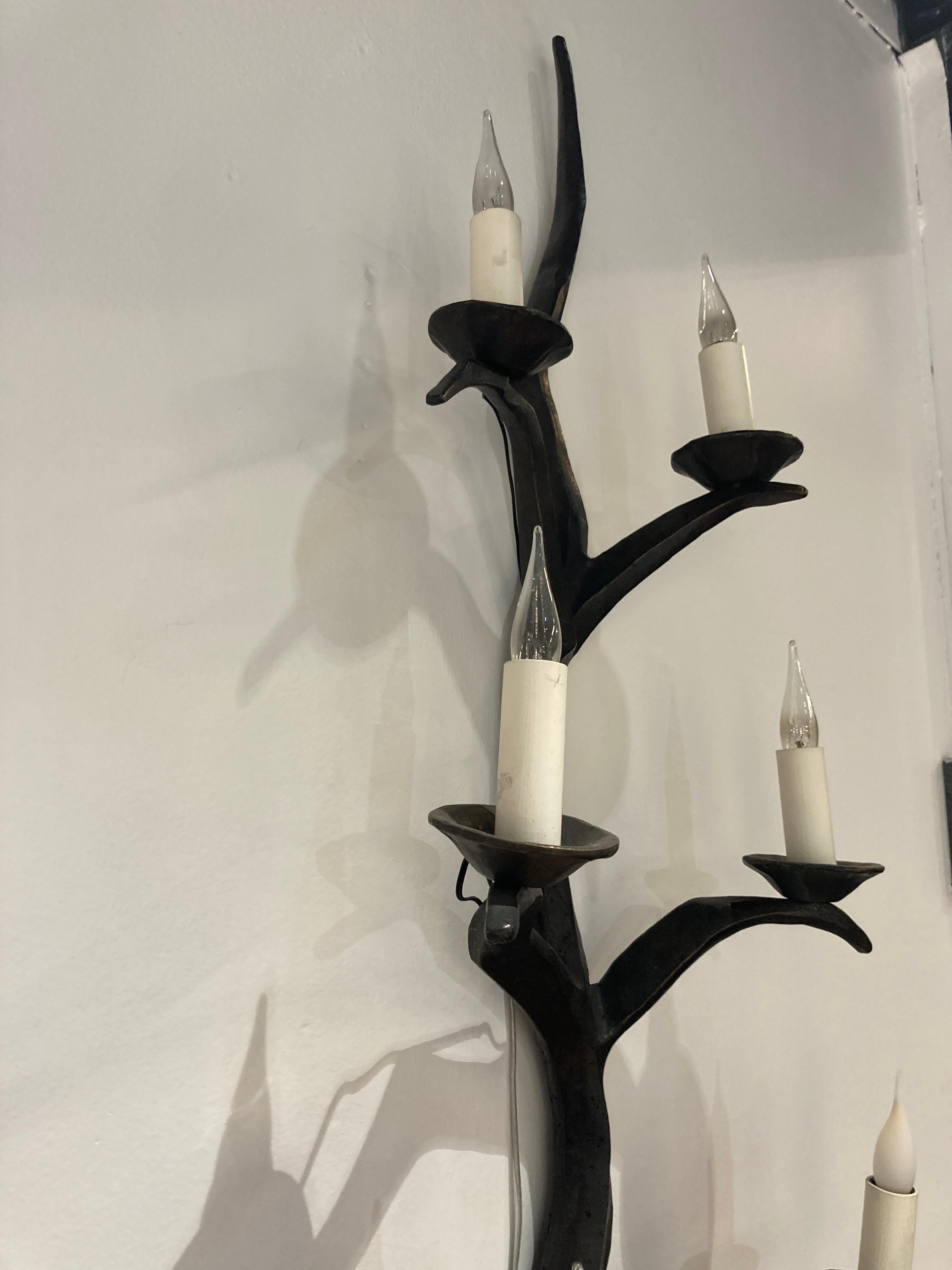 Bronze Pair tall bronze sconces in the style of Felix Agostini For Sale