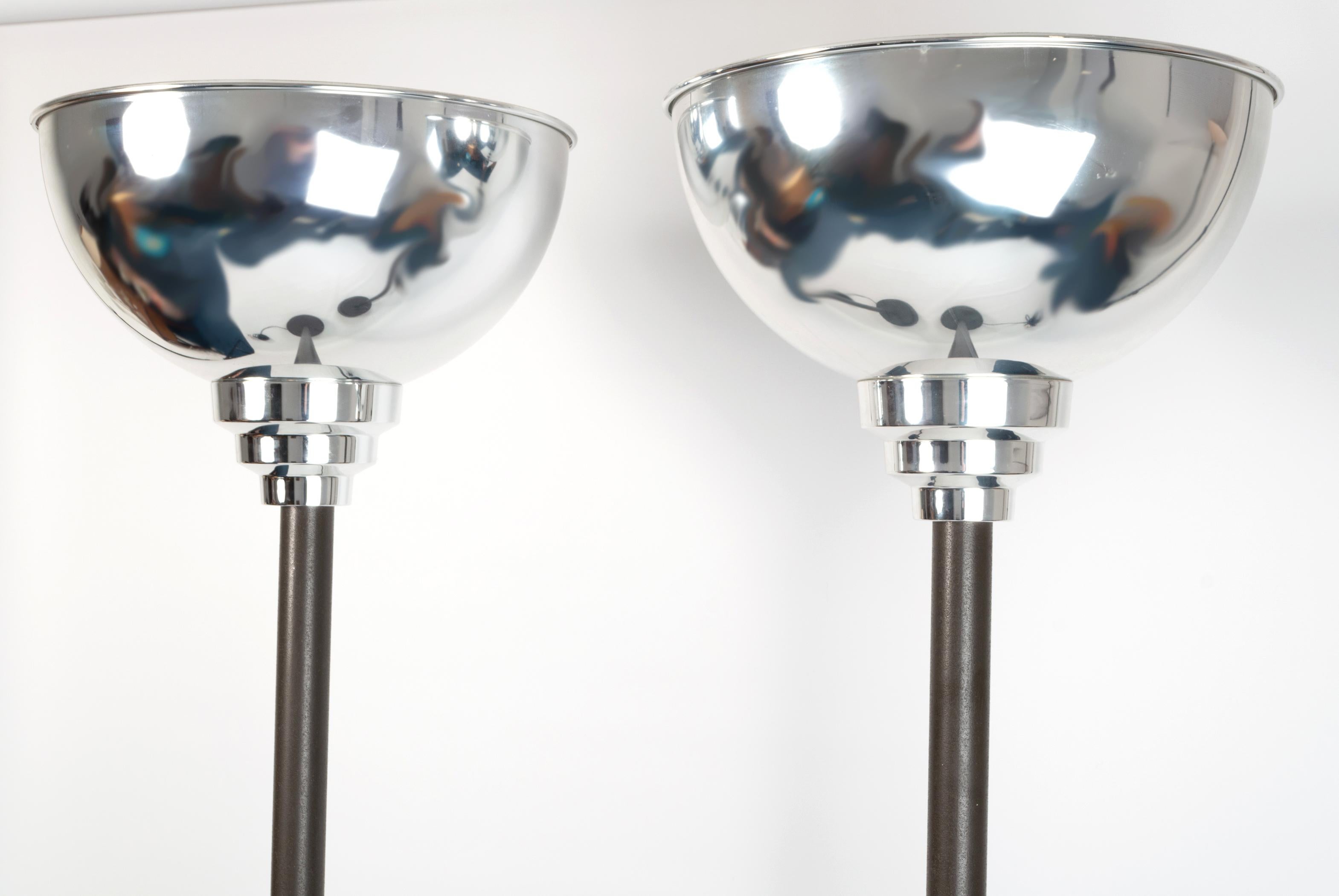 Pair Of English Art Deco chrome tall uplighter floor lamps by Thorn Electrical Industries, England. C.1930 (later to be acquired by the Austrian company, Zumtobel)

Classic Art Deco Odeon Design.
Dramatic proportions. A fantastic example.