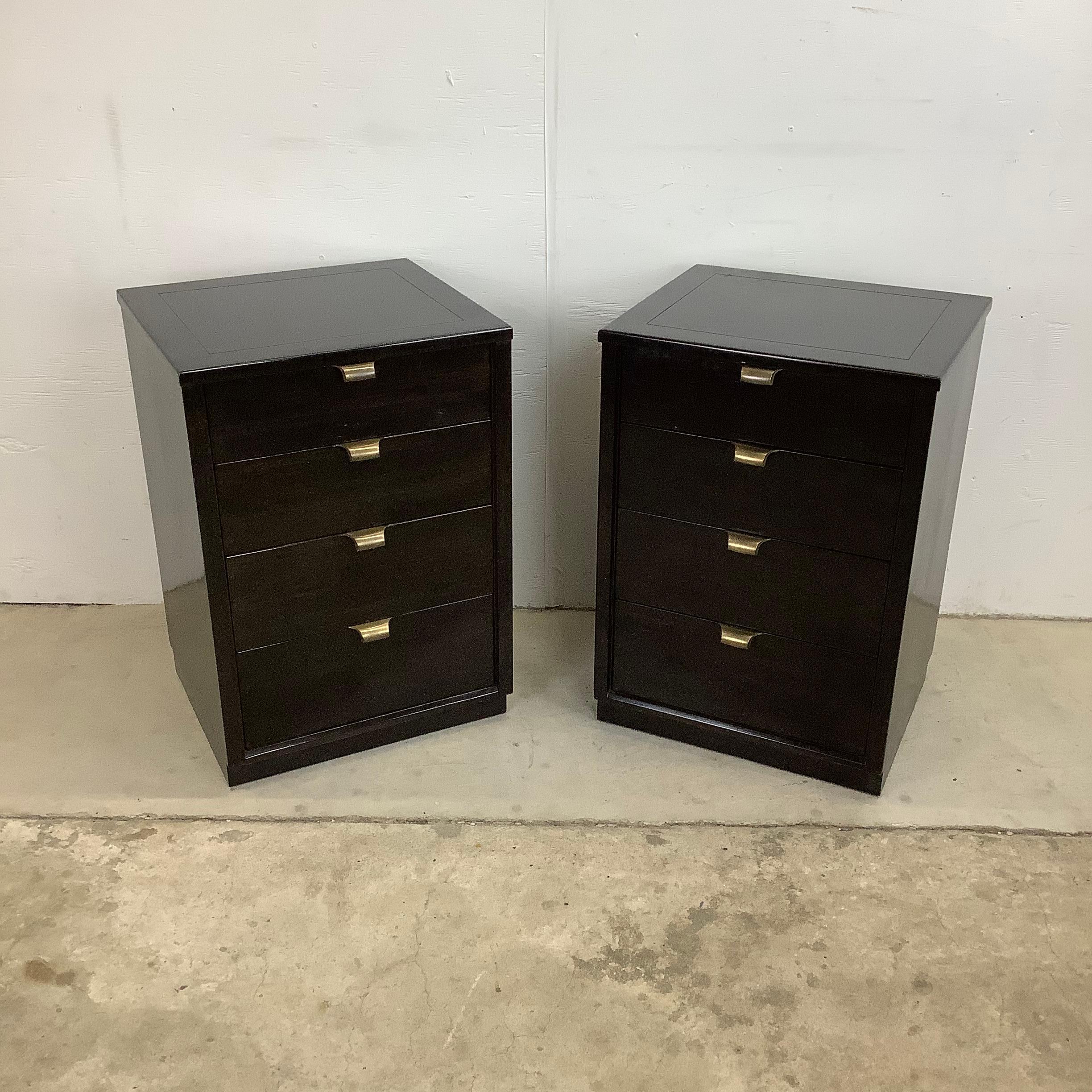 This impressive pair of vintage modern end tables from Drexel Furniture features a black lacquer finish with striking vintage metal drawer pulls. The tall four drawer pair of chests make excellent nightstands with plenty of bedside storage or as an