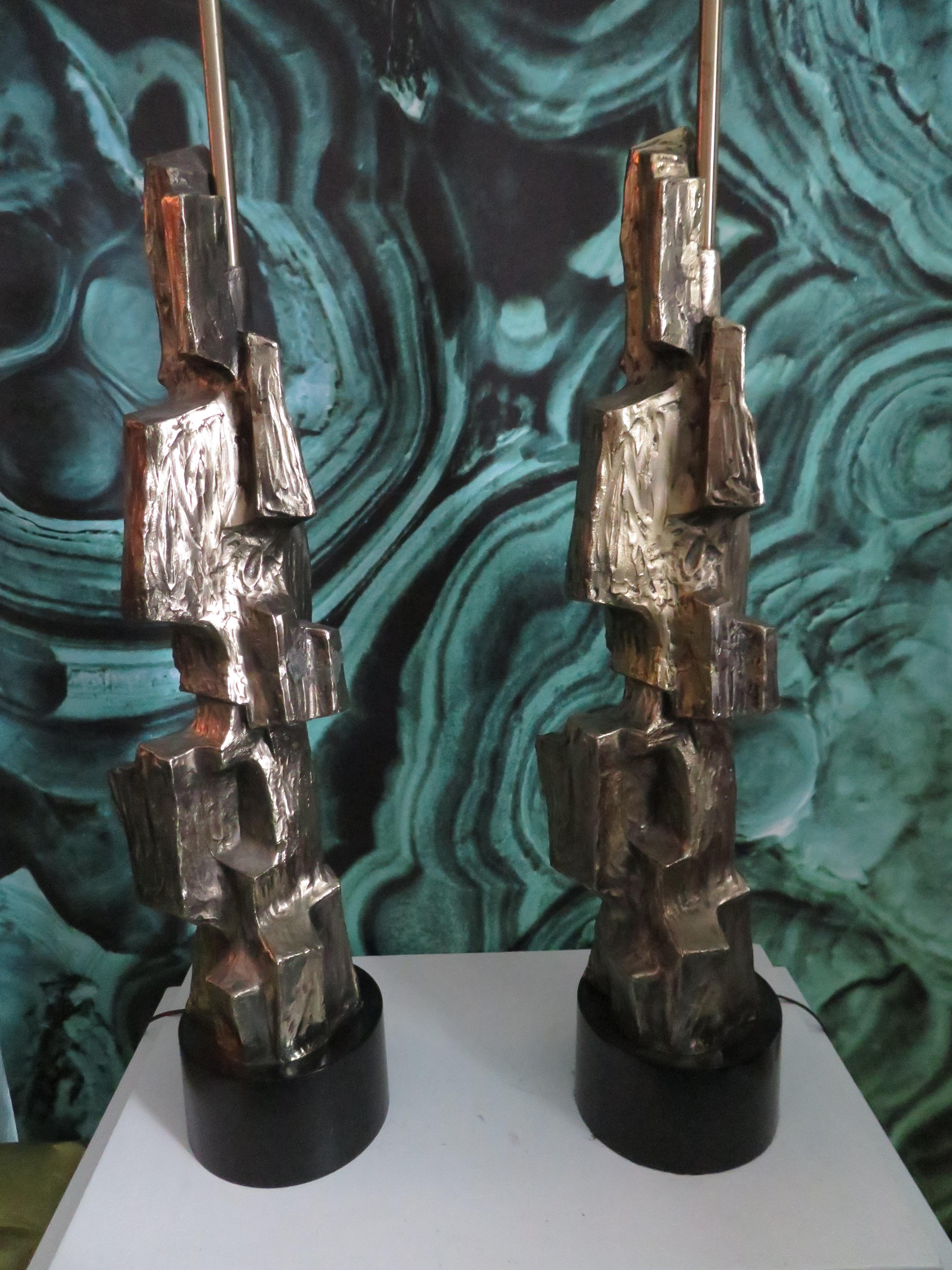 Gorgeous pair of Brutalist table lamps designed by Laurel Lamp Company, 1970s. These are what I like to call the Holy Grail of Laurel Lamps. These amazing lamps command attention in any setting. Try putting a pair of jeweled tone purple drum shades