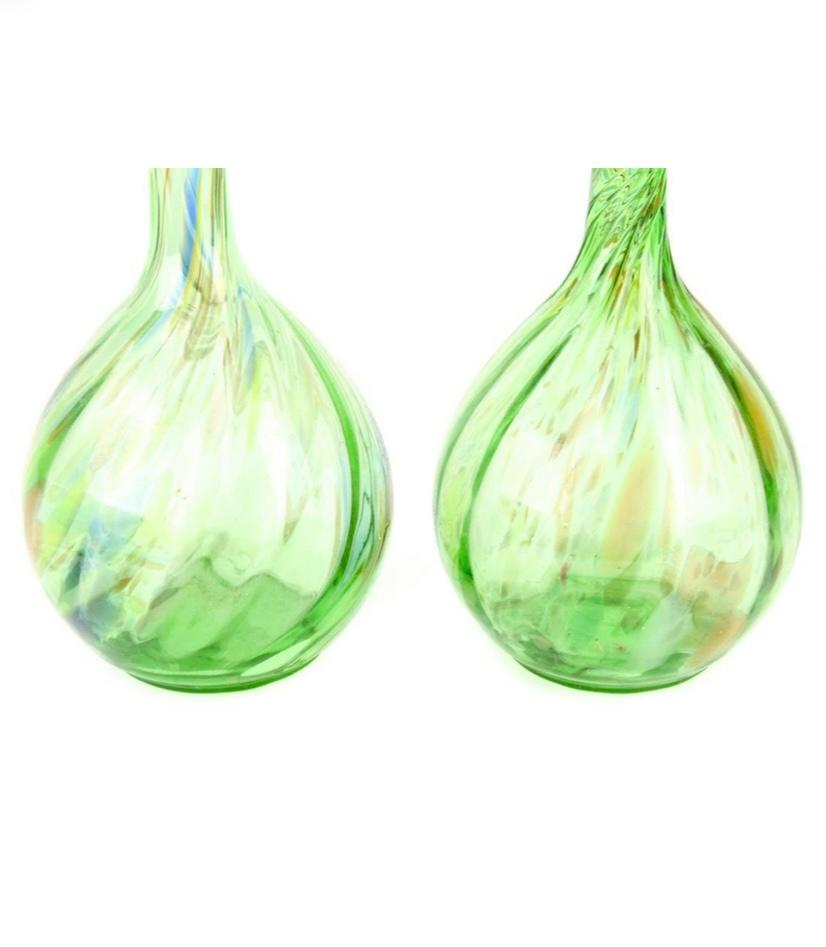 A pair of elegant tall mouth blown vases from the artisans on the Isle of Murano. This pair has green glass with hints of blue swirl and 24 karat blown gold inclusion. In wonderful vintage condition. The height is eighteen inches and the top rims