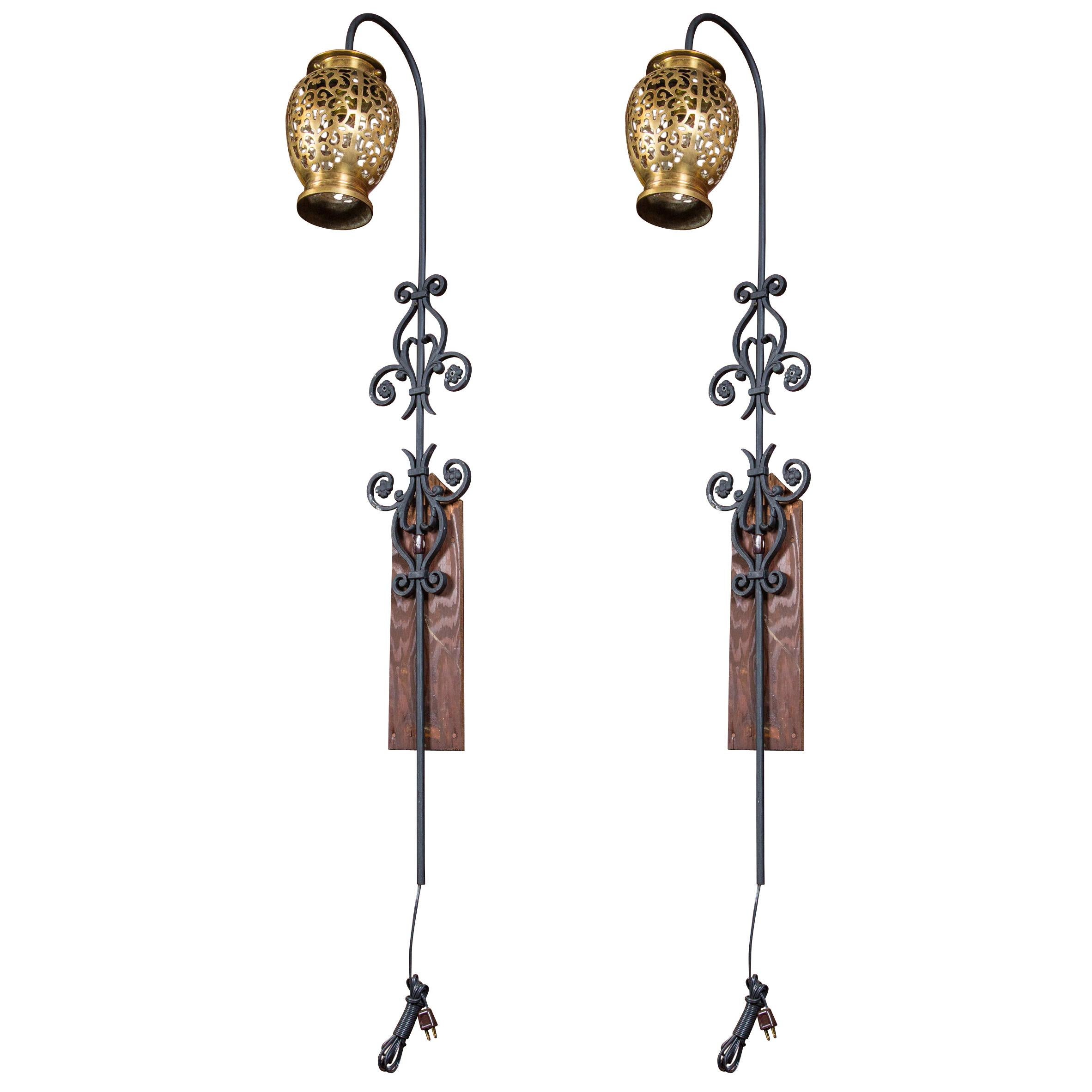 Pair of Tall Wrought Iron Wall Sconces with Hanging Brass Moroccan Lanterns For Sale