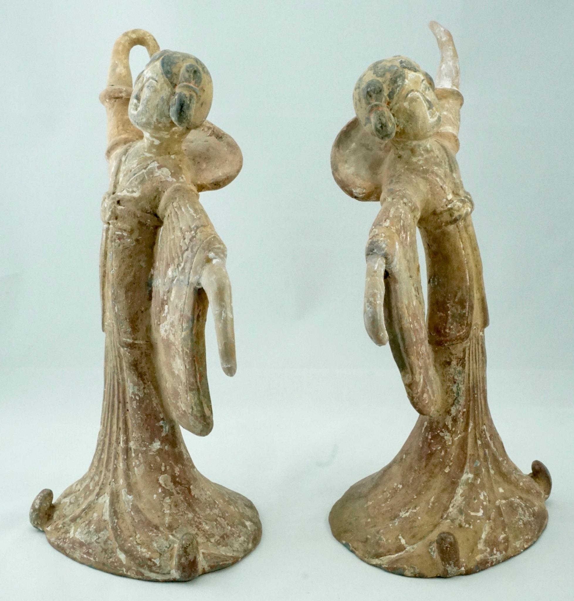 Period: Tang Dynasty (618 – 907 AD) terra-cotta over lead clay

A pair of delicate Tang Dynasty dancers with long sleeves. Both ladies are wearing a long flowing dress with flared sleeves. Their facial features are accentuated with black and white