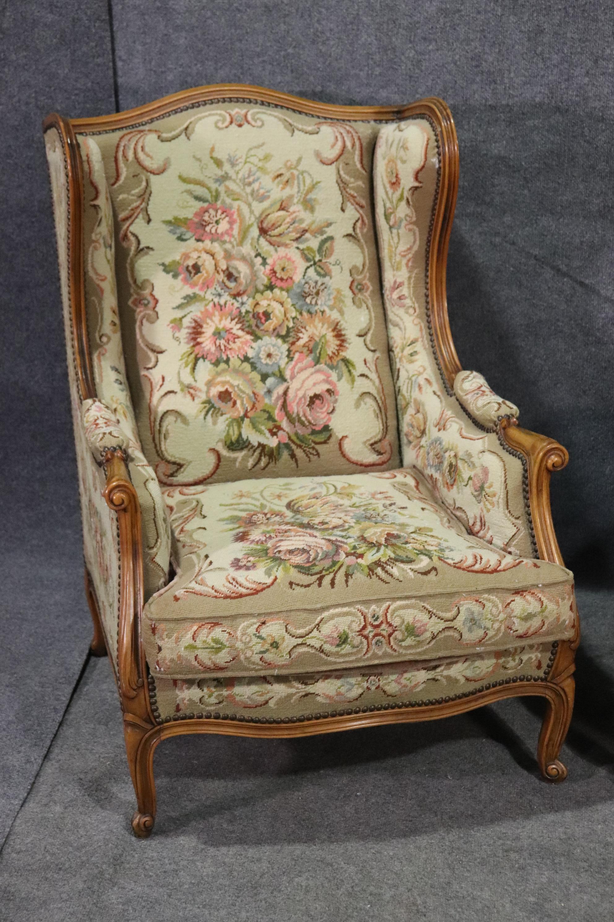 These are beautiful French wingchairs or bergère chairs. The chairs feature tapestry upholstery and walnut frames. The chairs are in good condition for their age. They date to the 1950s era and measure 38 tall x 28 wide x 36 deep and seat height is
