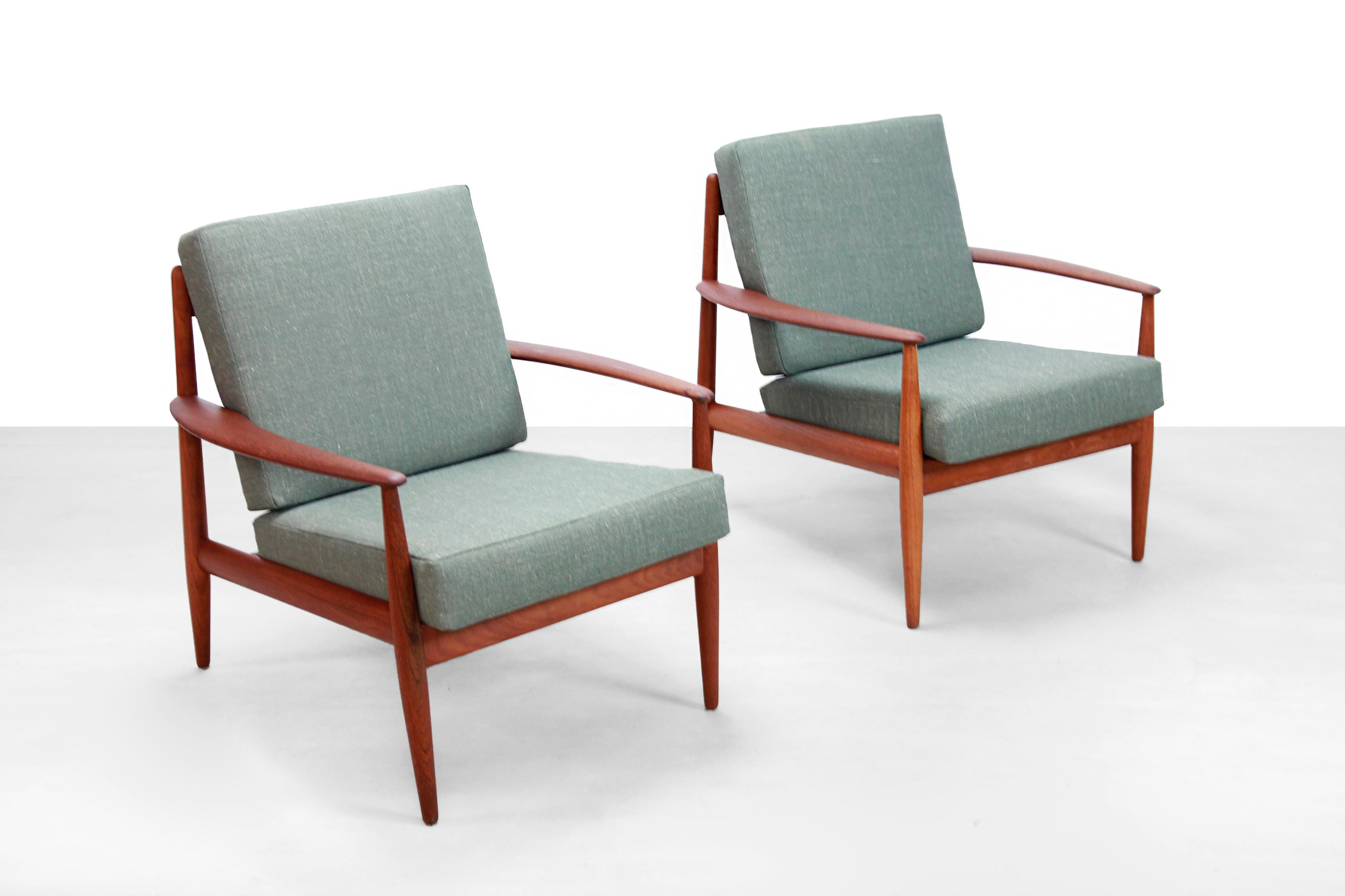 Beautiful set of vintage teak wooden model 118 lounge chairs. The armchairs are designed by Danish designer Grete Jalk and produced by France and Daverkosen. The chairs are marked with the old France and Daverkosen logo, which means that these