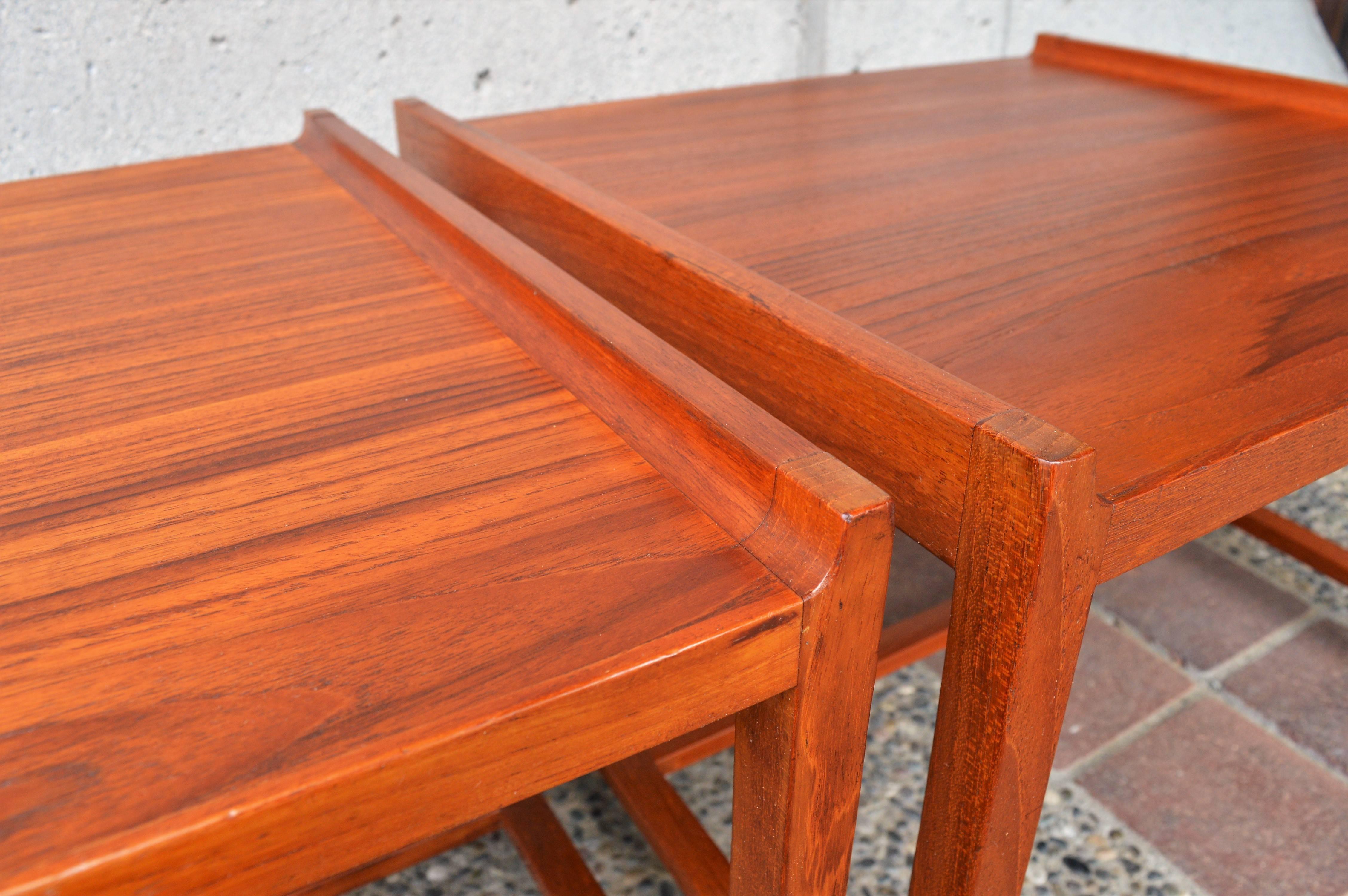 This great pair of Danish modern teak side tables have a wonderful minimalist look to them, and sultry flared edges. Quality made by Brode Blindheim (Norway) and in fabulous condition and with a lovely rich patina.