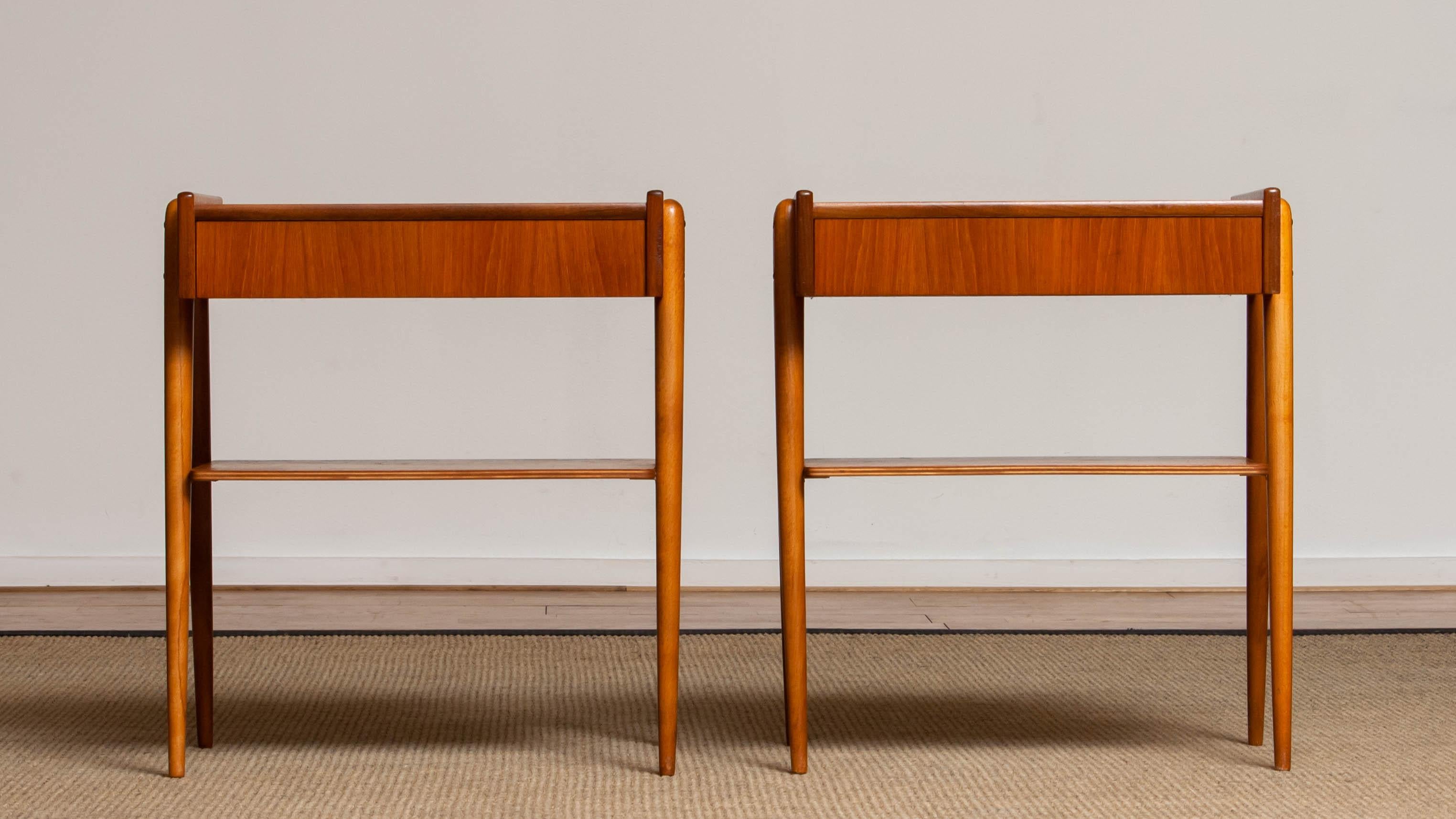 Beautiful set of two nightstands / bedside tables with drawer in teak from the 1950s and made by Carlström & Co Mobelfabrik in Sweden. 
The overall condition for both nightstands is good.
Please note that we will replace the inside bottoms of