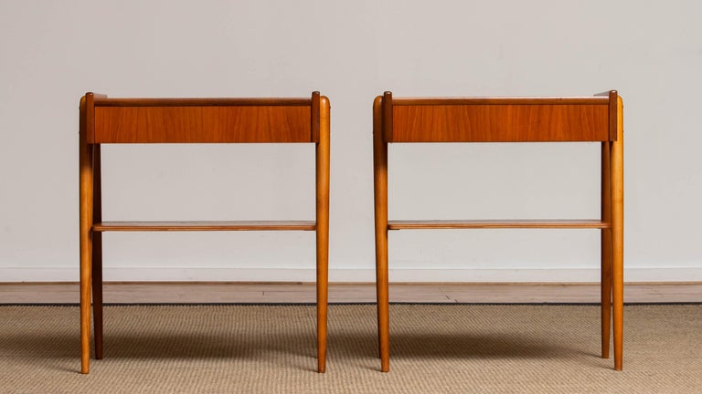 Beautiful set of two nightstands / bedside tables with drawer in teak from the 1950s and made by Carlström & Co Mobelfabrik in Sweden. 
The overall condition for both nightstands is good.
Please note that we will replace the inside bottoms of