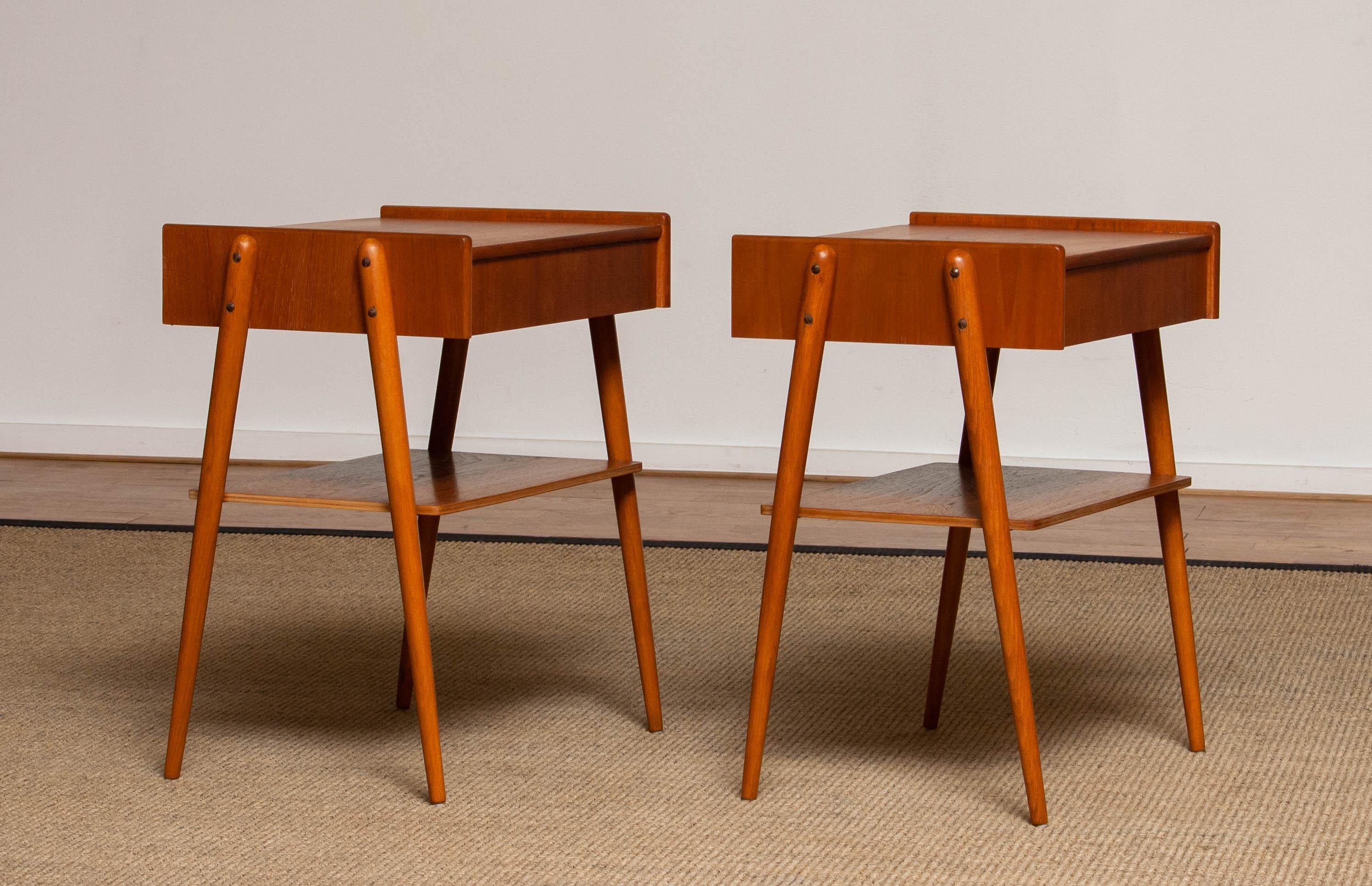 Beautiful set of two nightstands / bedside tables with drawer in teak from the 1950s and made by Carlström & Co Mobelfabrik in Sweden. 
The overall condition for both nightstands is good.
Please note that we will replace the inside bottoms of