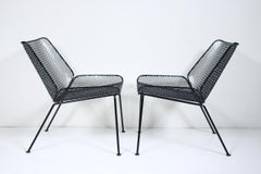 Pair Tempestini Style Black Wrought Iron & Expanded Wire Lounge Chairs, 1950's