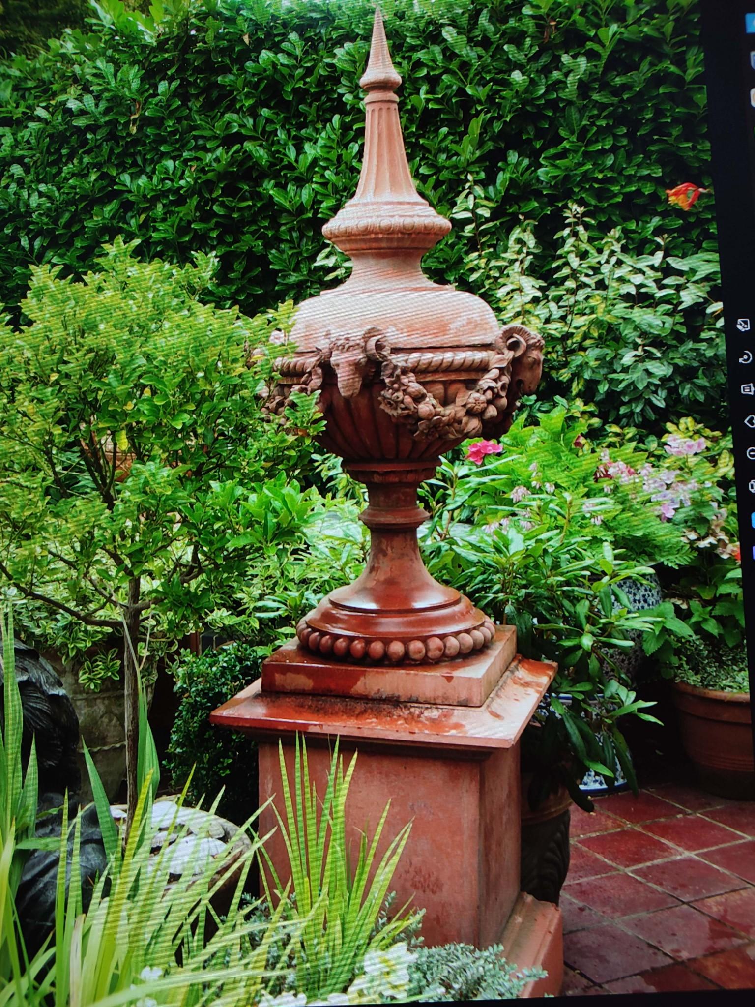 You are viewing a gorgeous pair of English terracotta garden stands on pedetal bases
Perfect for that classical English garden look
The top part - the finial - comes apart from the square pedestal stand in sits on 
This is for a pair but we would be