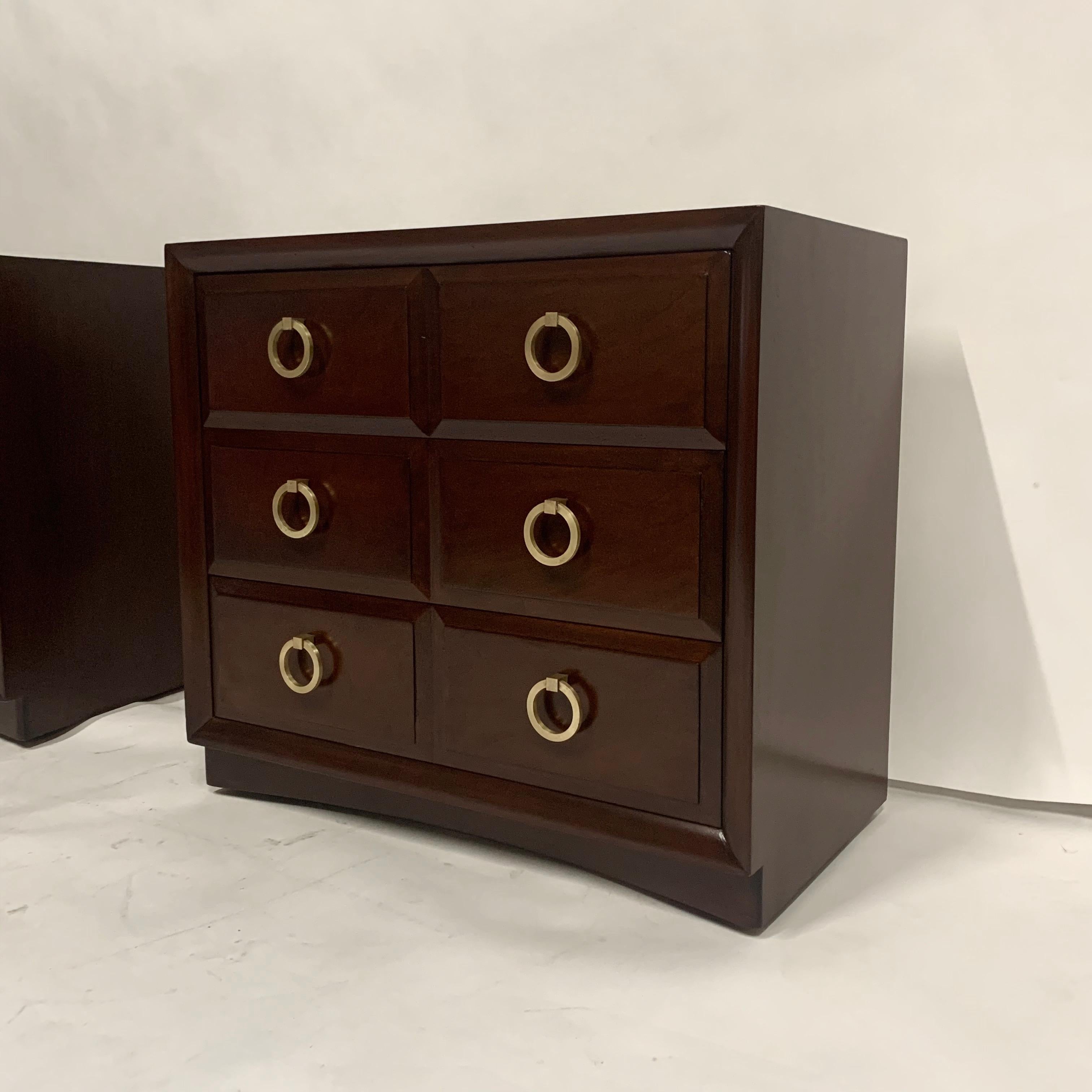 A very glamorous pair of three-drawer chests by Widdicomb and designed by T.H. Robsjohn Gibbings in the early 1950s. Expertly refinished in a deep mahogany lacquer and polished brass pulls. Scratch in original finish still shows through the refinish
