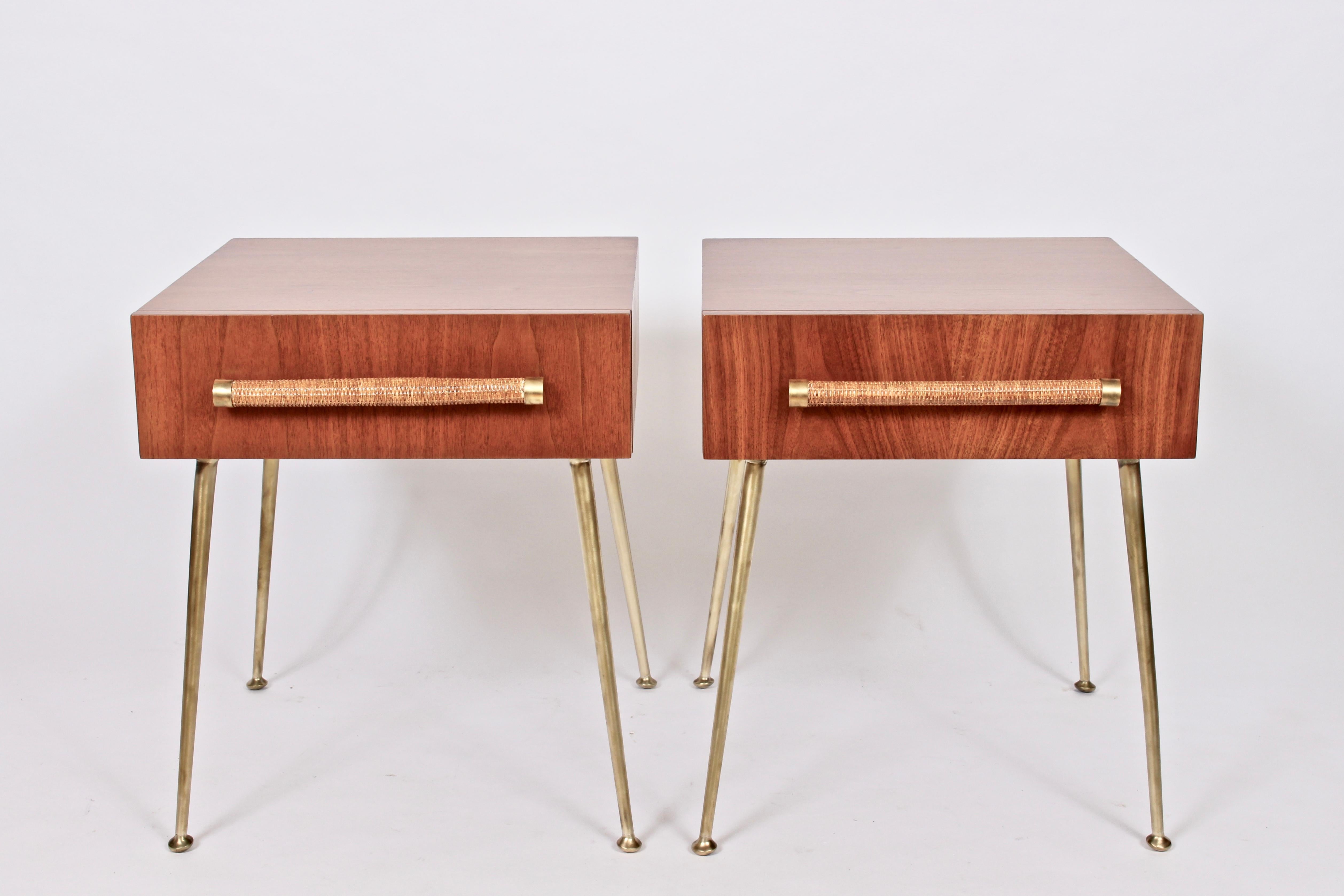 Pair of Robsjohn-Gibbings Model 4001 walnut, brass and Raffia tables, 1950s. Featuring wide drawers, splayed and capped brushed Brass legs, newly wrapped raffia handles with Brass details. Timeless. Fine design. With original fabric labels to drawer