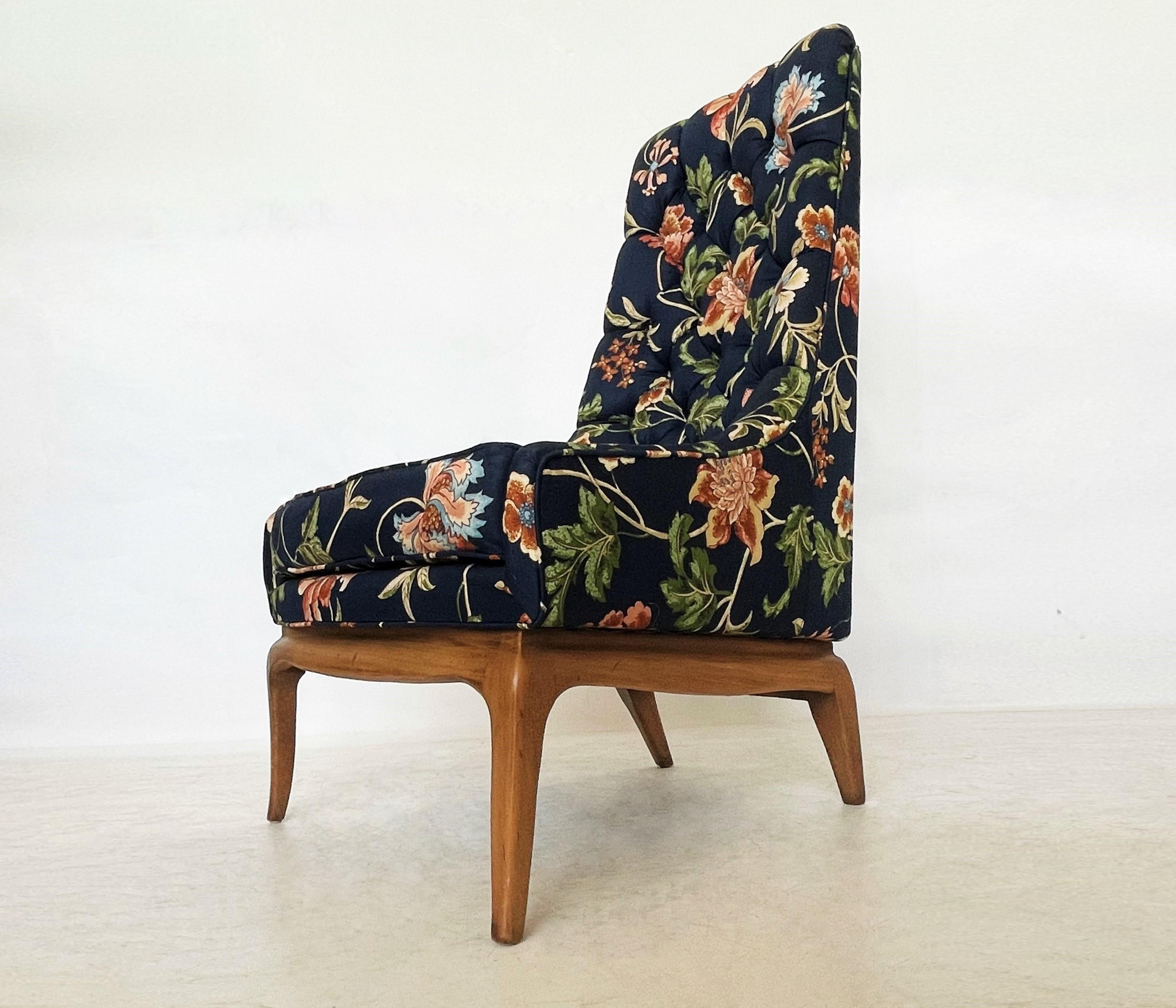 Displaying lovely lines with the high backs high and offering great versatility. This use of material in combination with the curved frame refers strongly to be Robsjohn-Gibbings designed. Featuring tufted high backs in original floral upholstery