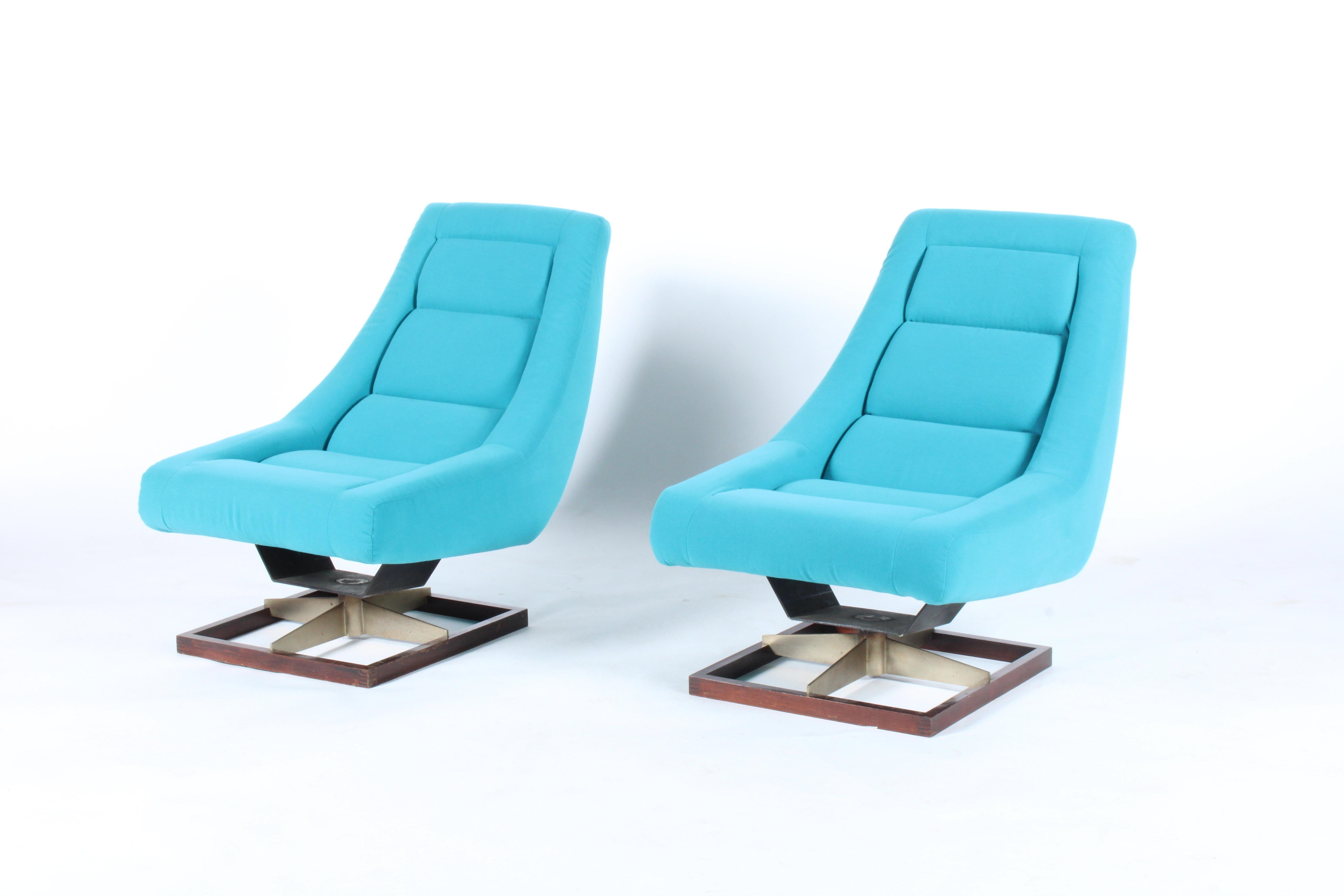 Striking pair of vintage Italian lounge chairs which we have had newly upholstered in a vivid blue fabric. Sourced from a private residence in beautiful Verona, Italy this gorgeous pair are the perfect set to make a real impact in any private or