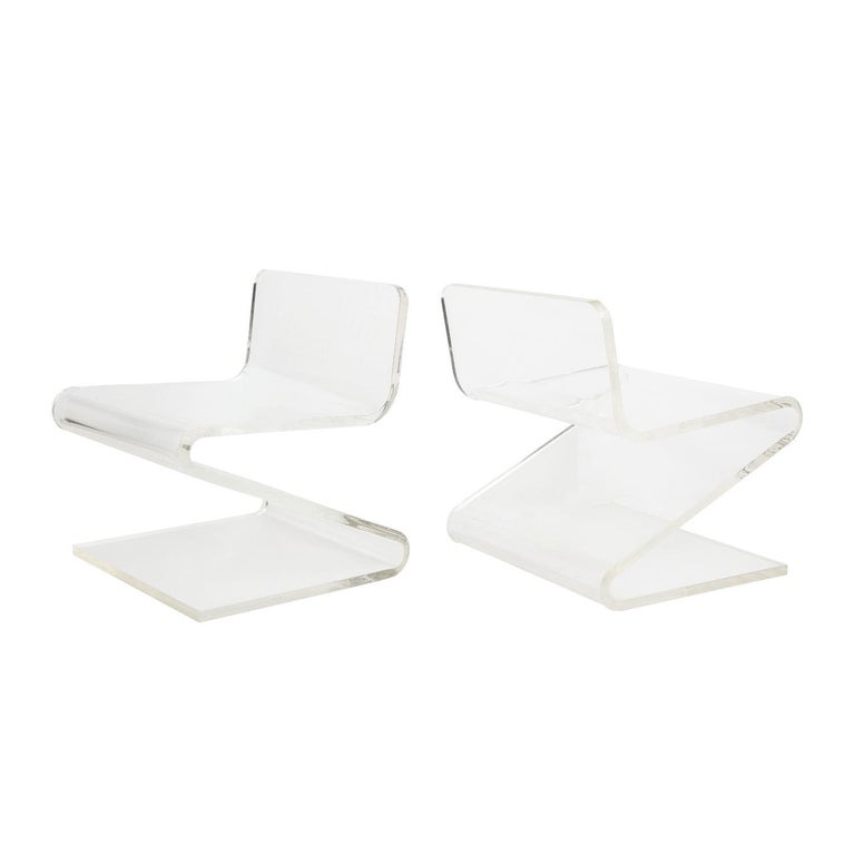 Chic pair of thick molded Lucite slipper chairs, custom design, American 1970's. These are beautifully made and were custom designed for a NYC interior in the 1970’s.