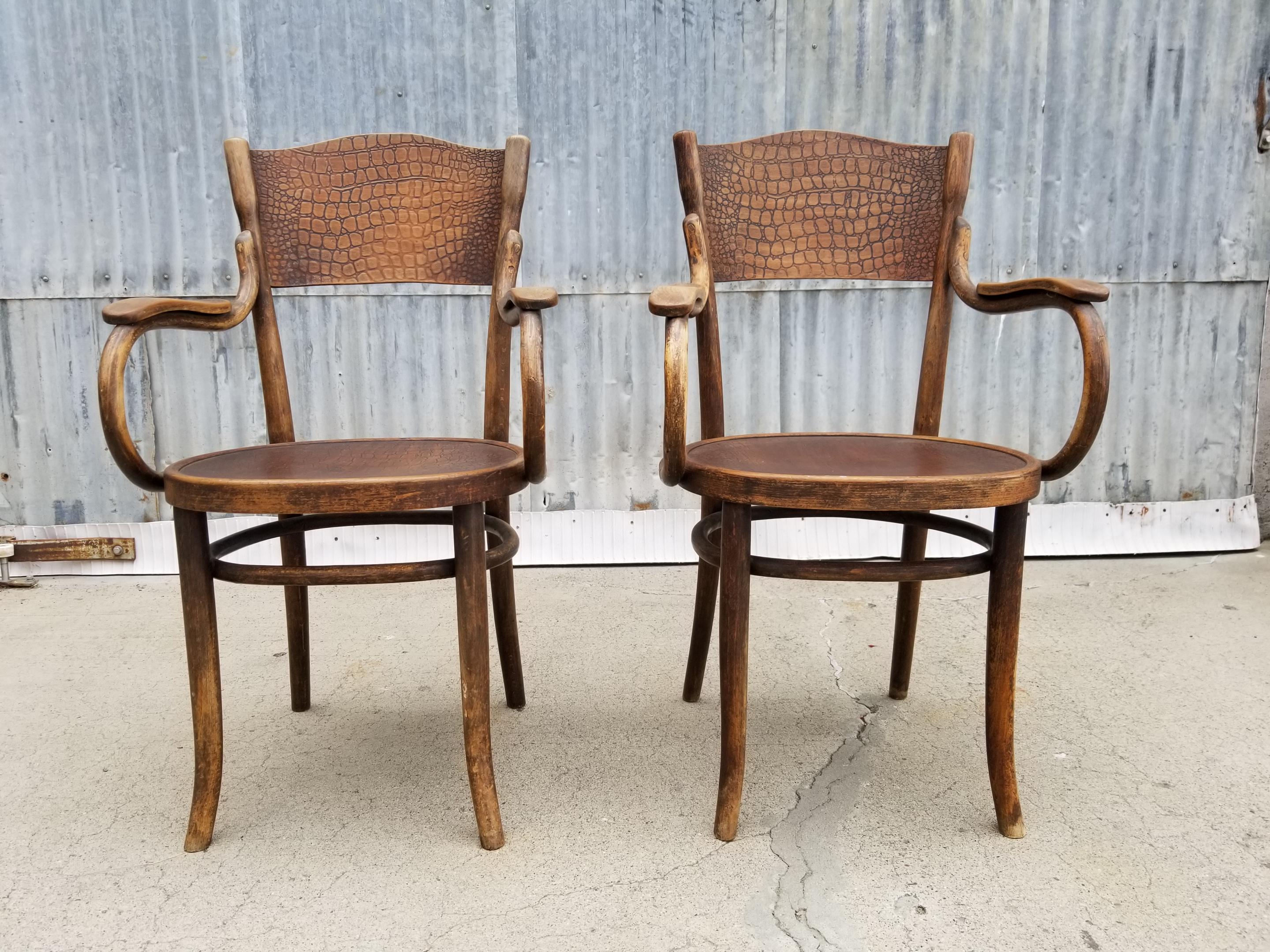 Pair of signed Thonet armchairs with alligator pattern seat and seat back. Retaining partial paper label and impressed 