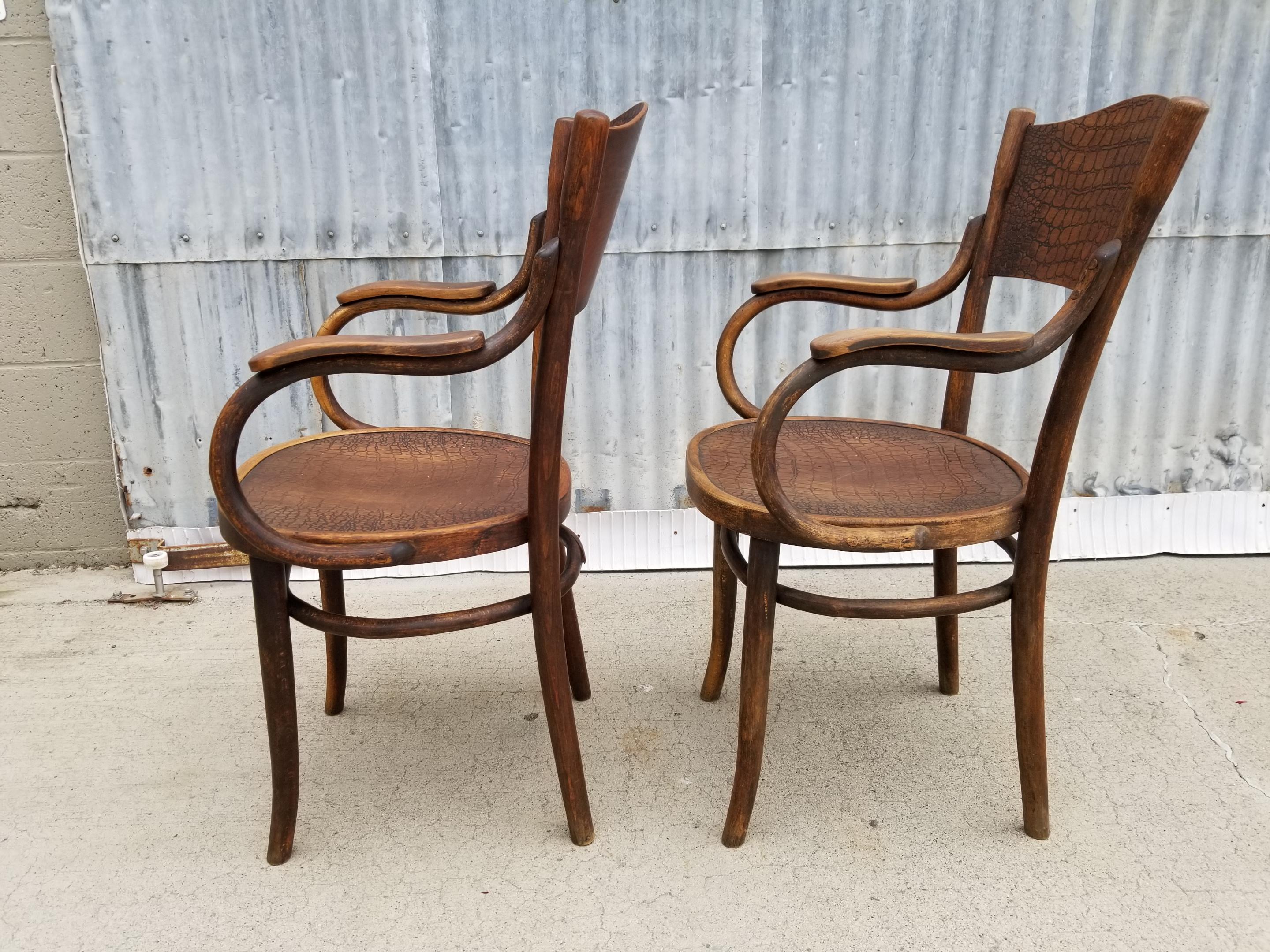 Pair of signed Thonet armchairs with alligator pattern seat and seat back. Retaining partial paper label and impressed 