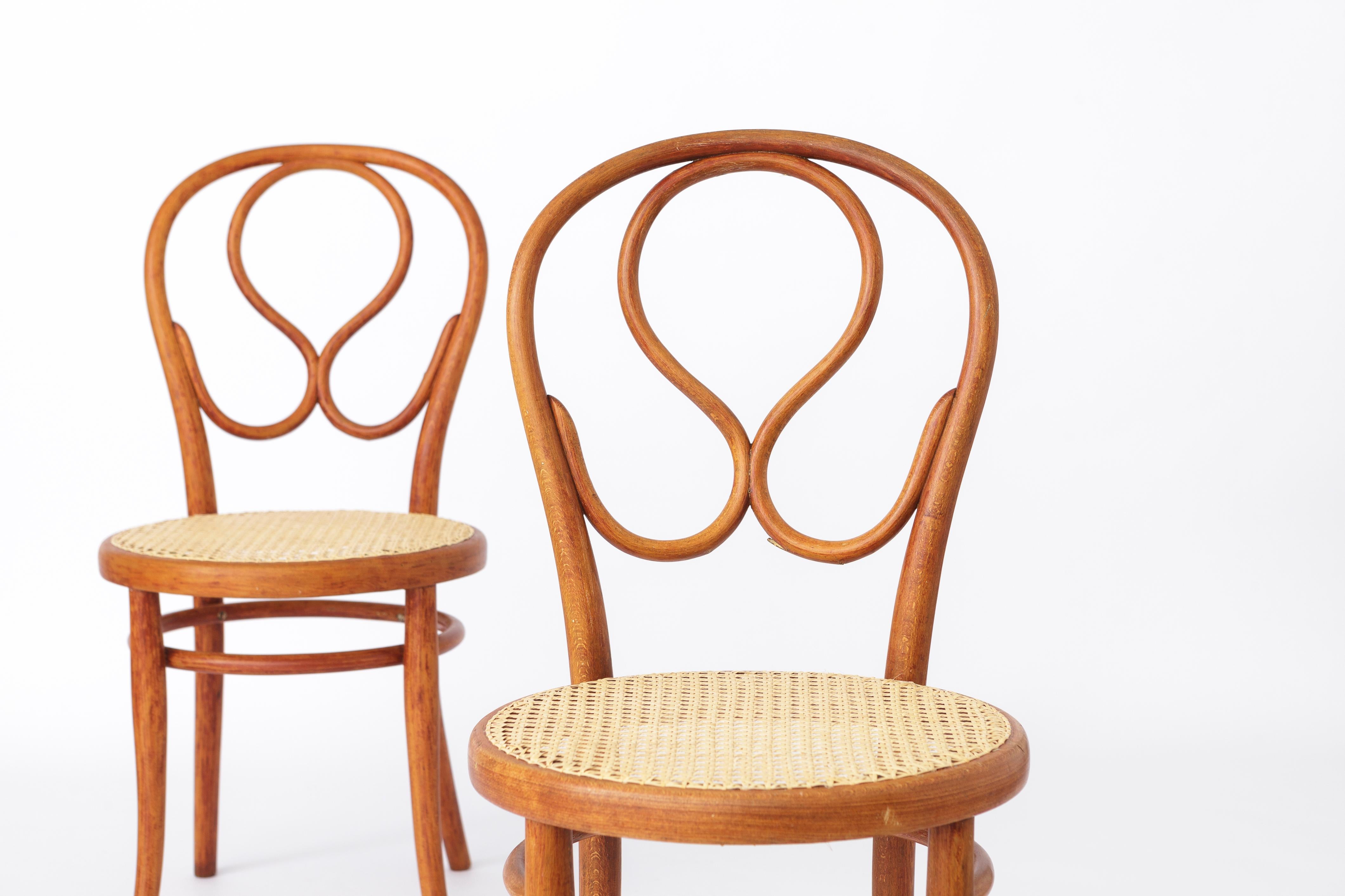 Two stunning Thonet chairs, the inventor of bentwood furniture mid of 19th century. Here two beautiful models no. 20. Carefully restored, hand-rewoven cane seats. Design 1880s, manufacturing end of 19th - beginning of 20th century. 

Displayed price