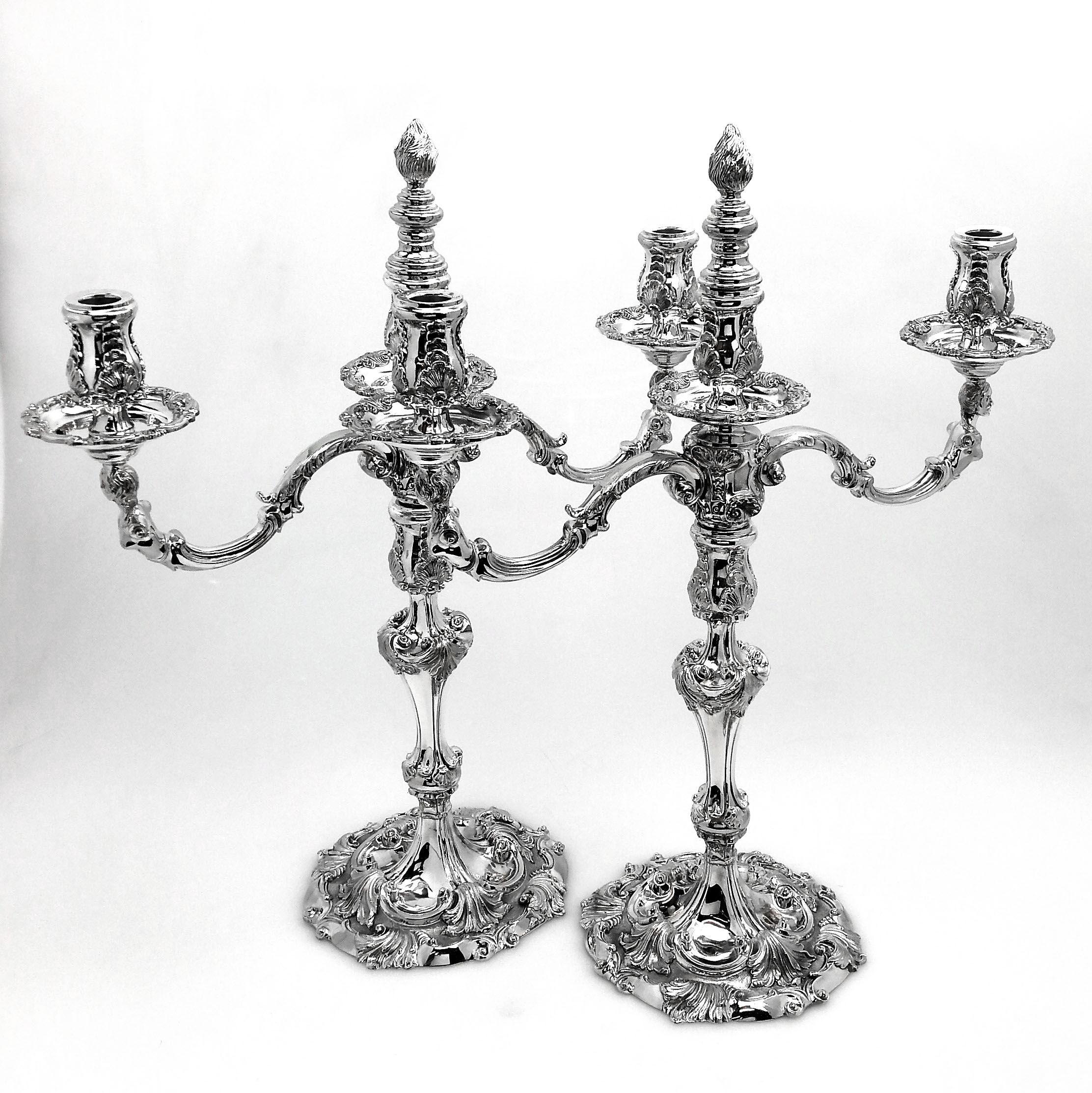A magnificent pair of Tiffany & Co. sterling Silver three-light Candelabra that convert into two-light Candelabra and into single Candlesticks. These Candelabra are inspired by the original Georgian Designed candelabra by Kirby, Kirby, Waterhouse,