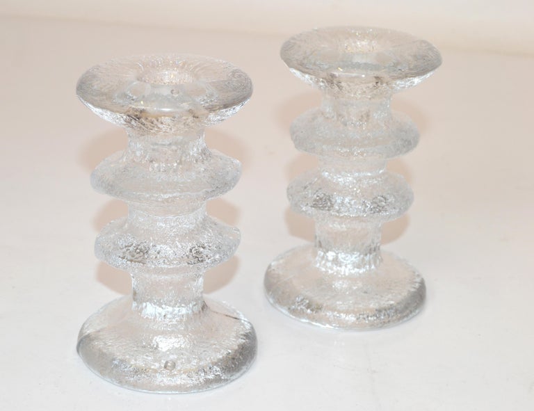 Pair of Scandinavian Modern Finland Iittala Art Glass with bubbles Festivo Candle Holders designed by Timo Sarpaneva, made in the late 1970s.
Top Candle hole measures: 0.75 inches.
Core Diameter measures: 2.75 inches.