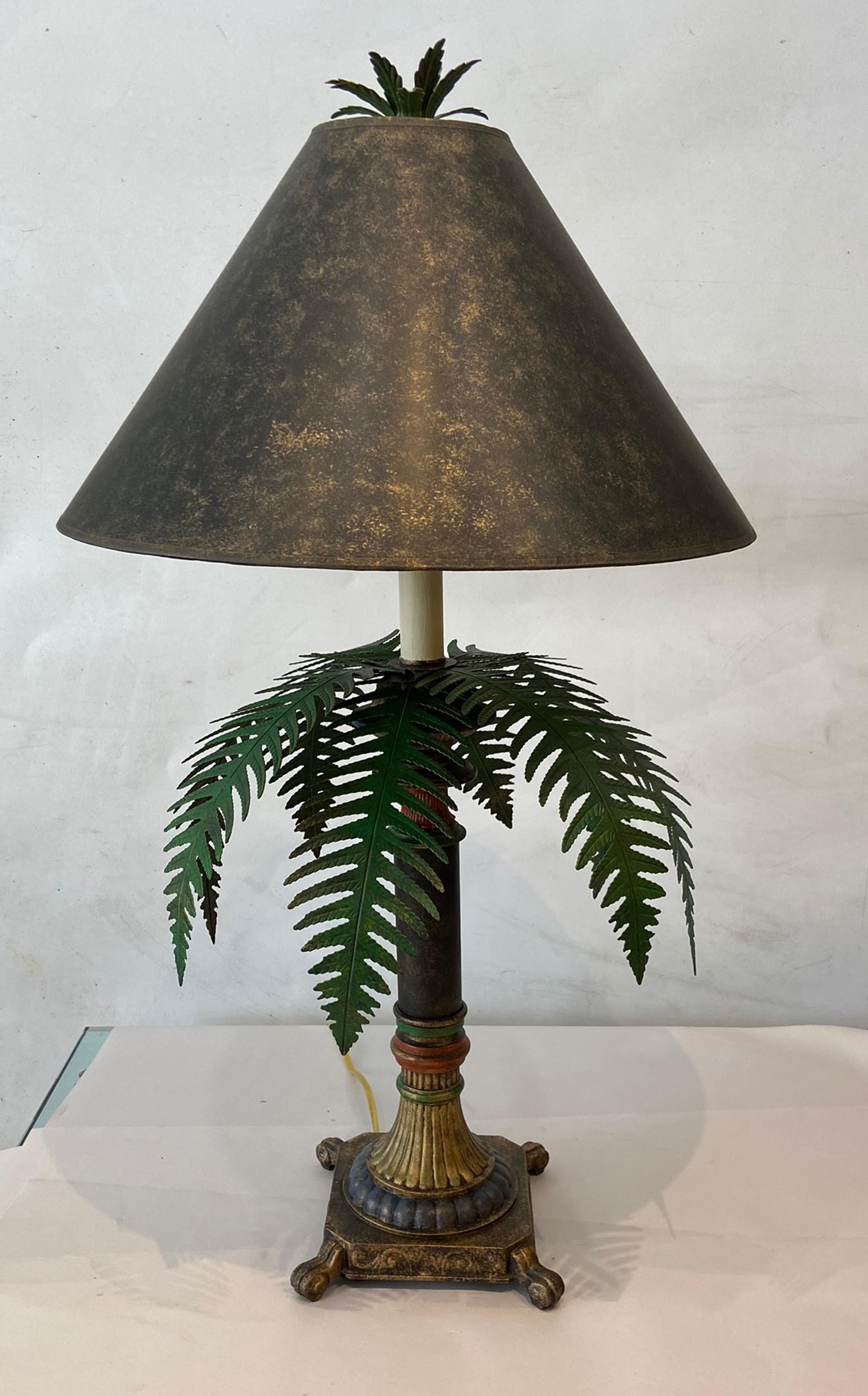 Pair of tole ware table lamps probably made by Maitland Smith. Well-made heavy lamps in very good condition. Tole-ware cut metal leafs on a heavy metal stem and base. Recently rewired. Ready to be used.