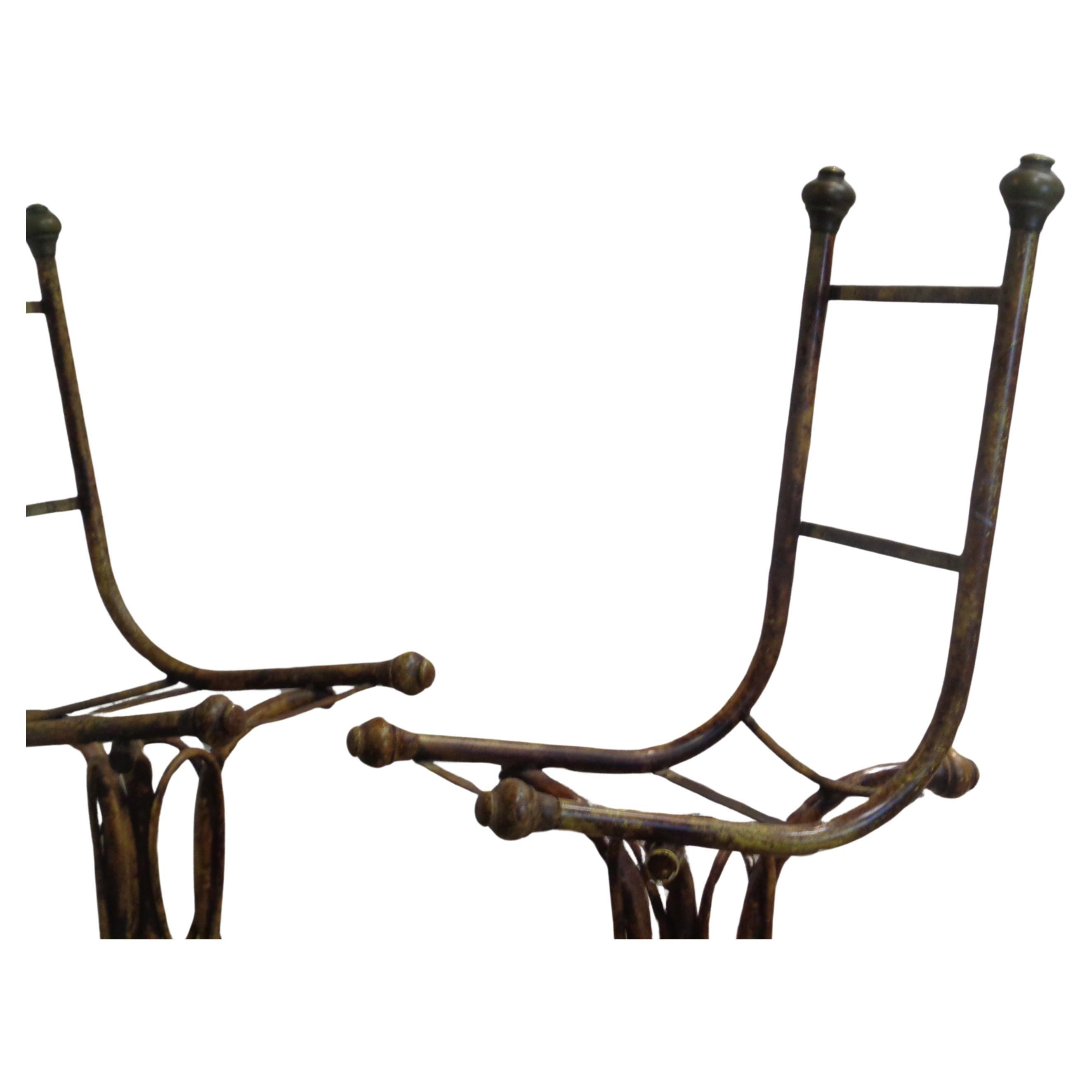 A pair of unusual faux bamboo bentwood like iron chairs in original tortoise painted factory finish / bronze brass caps at two top posts and three bottom ends / two tortoise painted large wood caps at front of iron seats and one behind iron seat /
