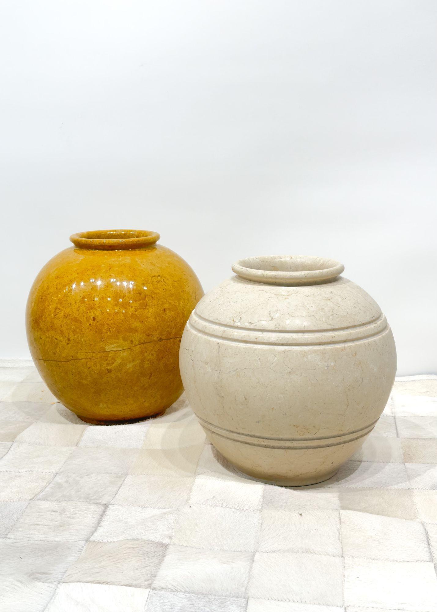 Pair travertine vessels, 1980. Excellent condition and very heavy and solid.
Measures 12