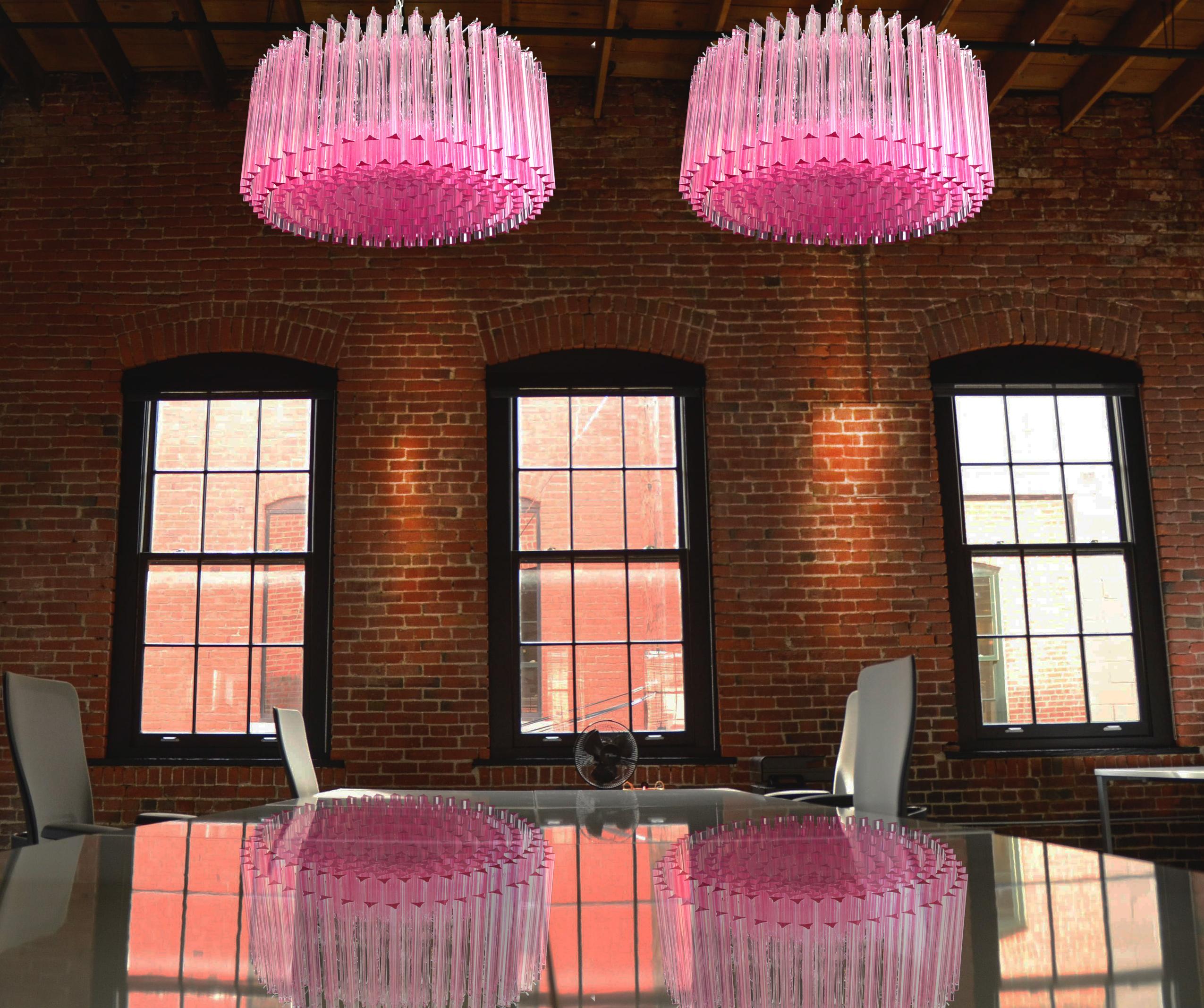 Pair magnificent Murano glass chandeliers, 265 pink triedri on crome frame. This large midcentury Italian chandelier is truly a timeless Classic.
Period: late 20th century
Dimensions: 43.30 inches (110 cm) height with chain; 15.75 inches (40 cm)