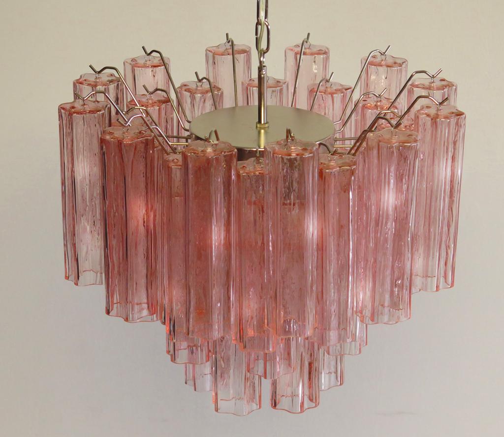 Pair of Italian vintage chandeliers in Murano glass and nickel-plated metal structure. The armor polished nickel supports 36 large pink glass tubes in a star shape.
Period: Late 20th century
Dimensions: 45.30 inches (115 cm) height with chain,
