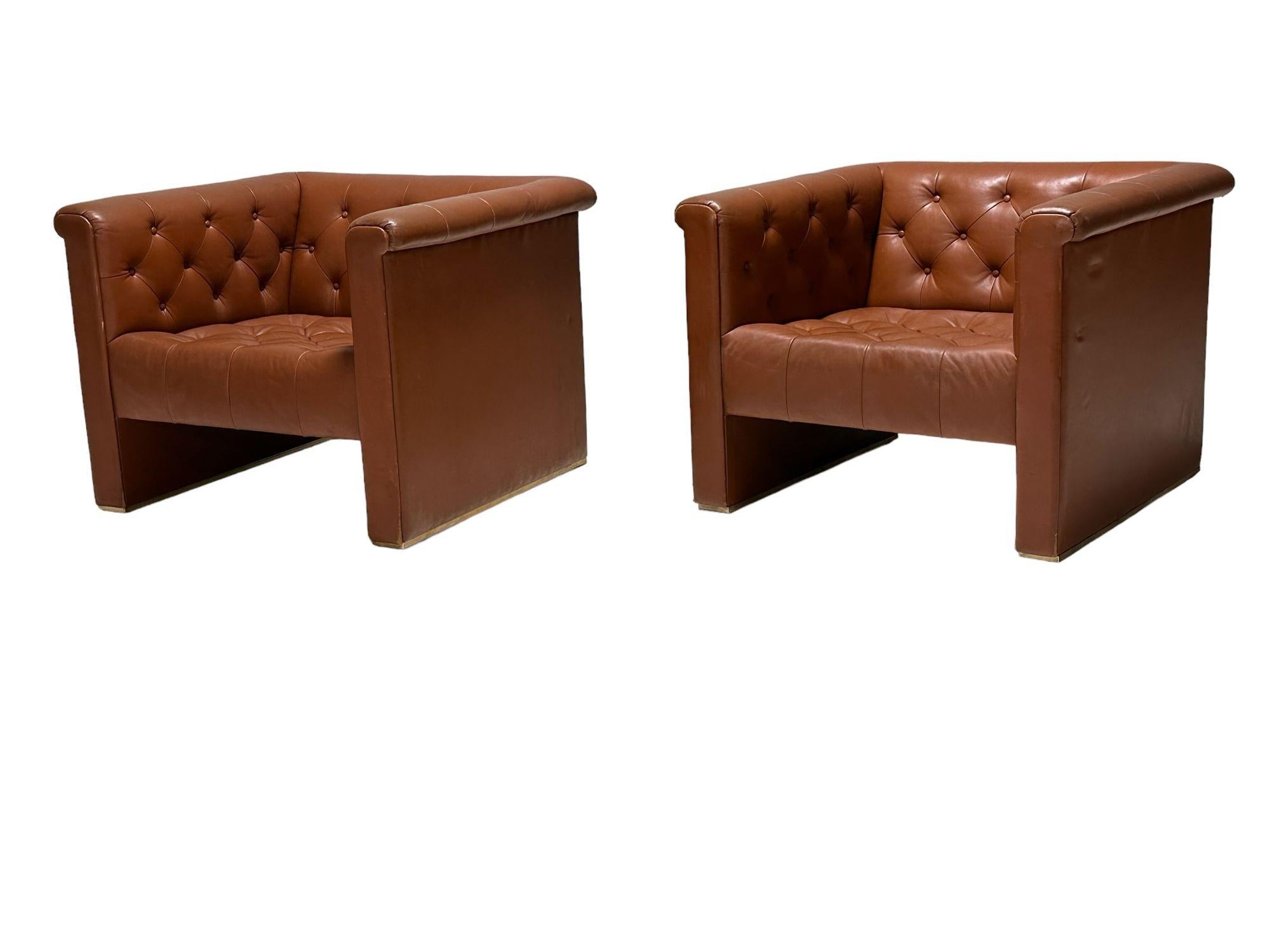 Pair tufted cube leather club chairs, 1970. Original leather.