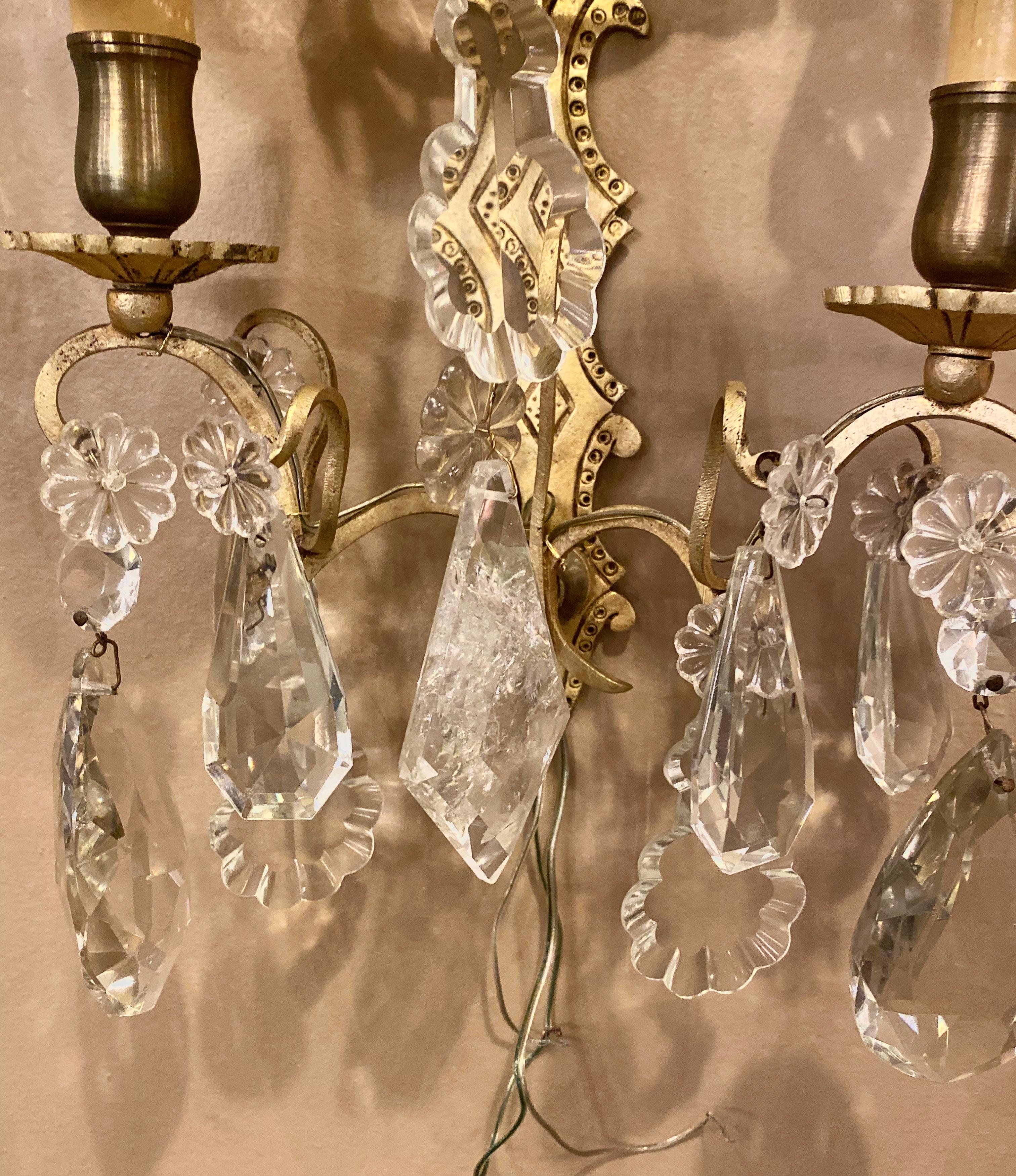 Pair of two light covered mixed crystal and rock crystal bronze wall sconces each having matching shield shade covers with solid bronze back plates.
1SX.