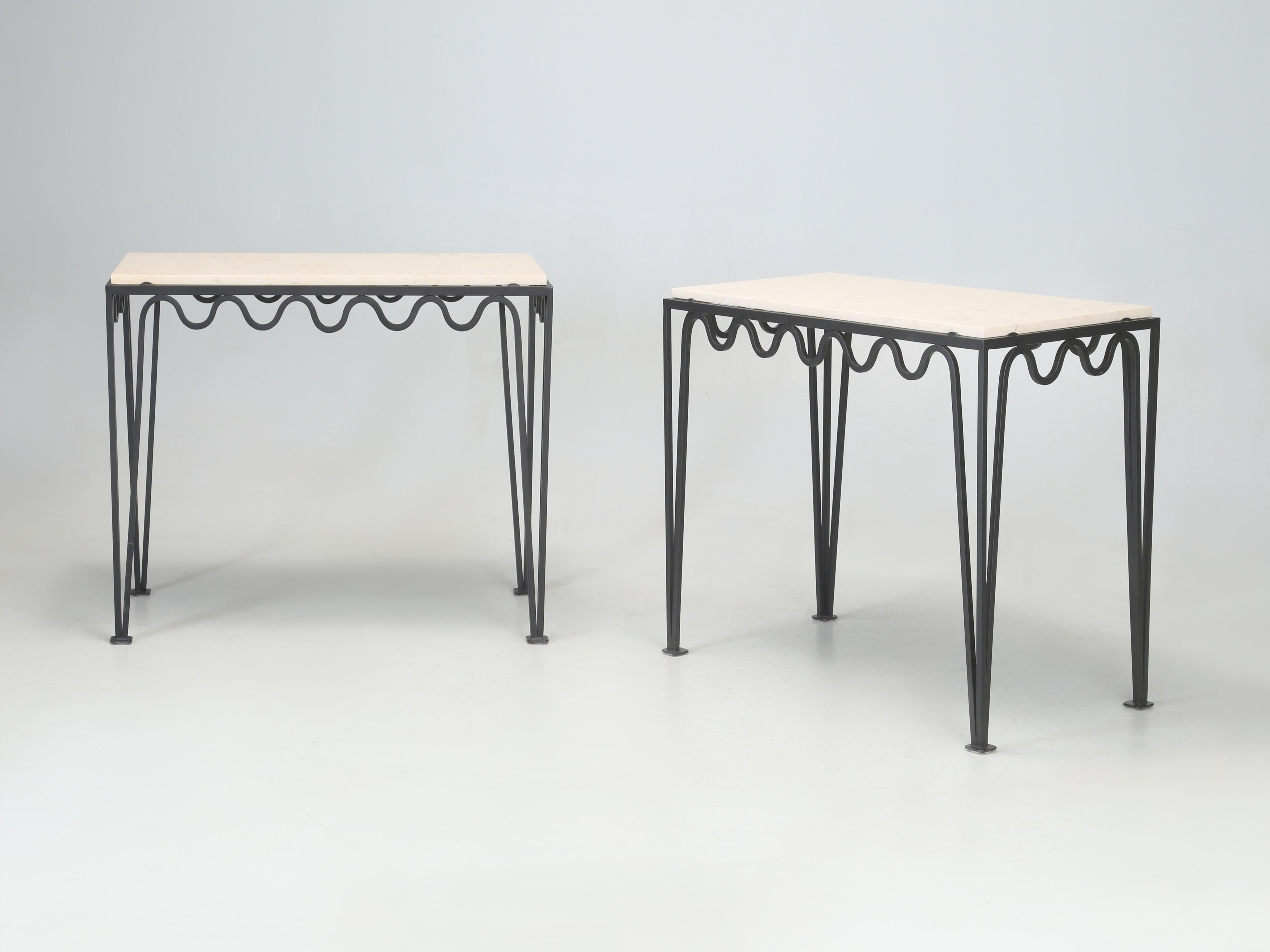 Pair of Undulating 'Méandre' Wrought Iron Console Tables fitted with Limestone tops. These were made in France and custom ordered without the standard glass top surfaces and were replaced with a Classic Limestone, which adds not only practicality,