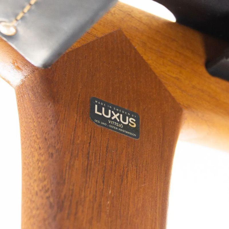 Listed for sale is an original pair of very rare 1954 Hunting chairs, produced by Luxus in Sweden. The chairs were designed by Uno & Östen Kristiansson. These examples are in excellent original condition with beautiful black saddle leather