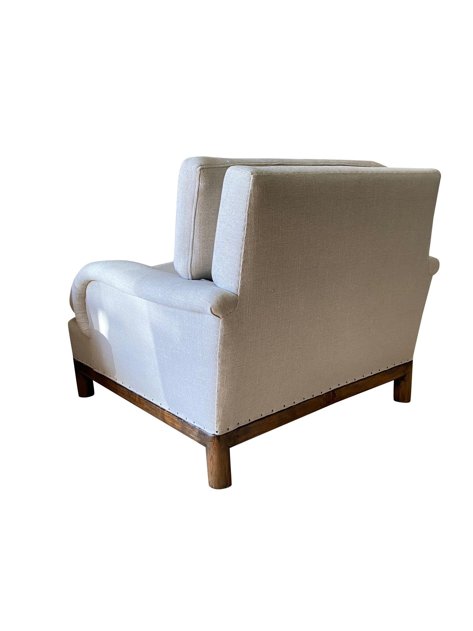 1940s English pair of very comfortable club chairs are attributed to Robsjohn-Gibbings.
Terence Harold Robsjohn-Gibbings was a British born architect turned decorator.  His designs are known for a mixture of classic Greek and Art Deco.
These chairs