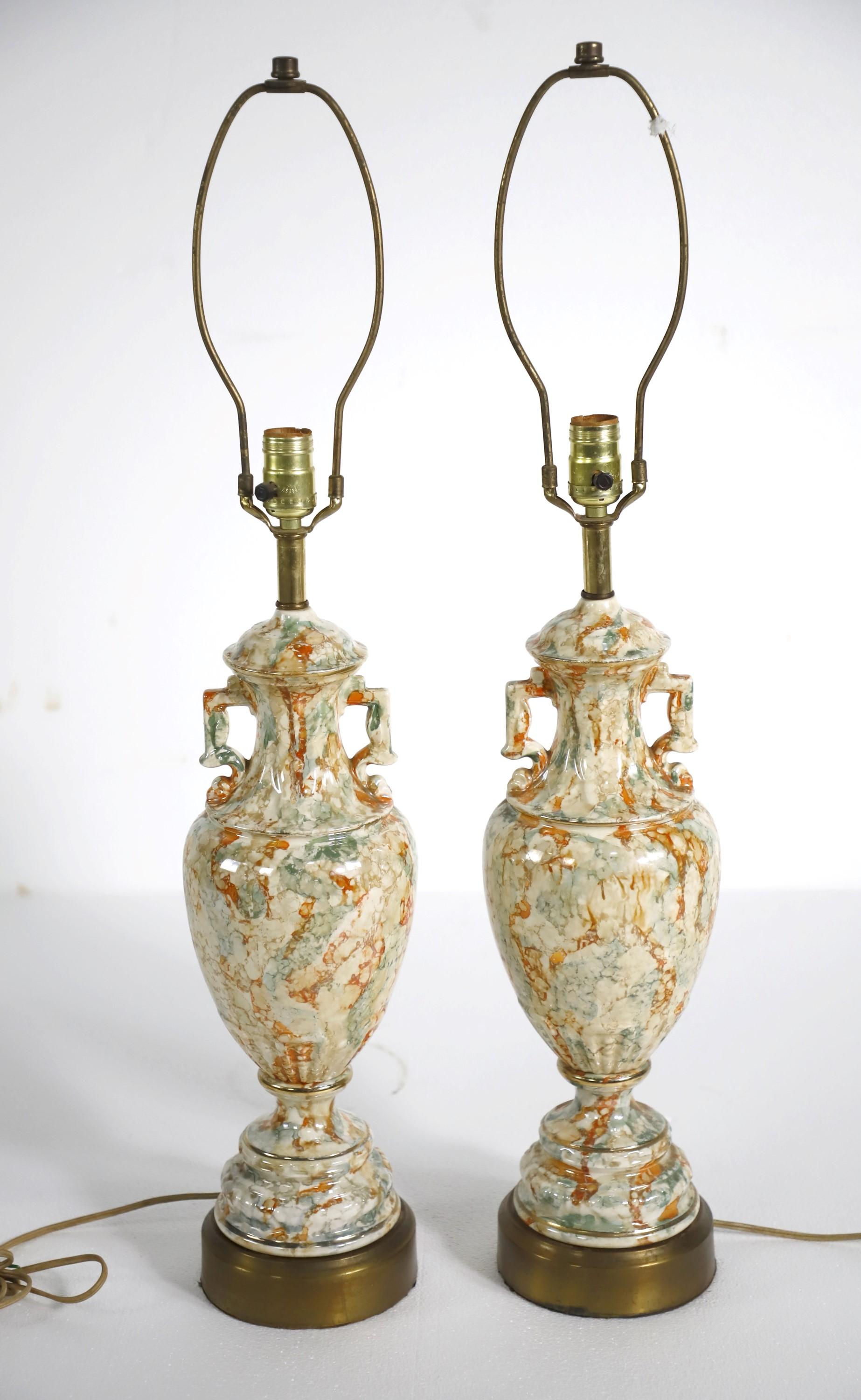 Urn shaped glazed ceramic table lamps with a colorful marble effect of orange, green, beige, and off white. The base is made of brass plated metal. There is some wear on the base. Please see the photos. Cleaned and restored. Priced as a pair. Please