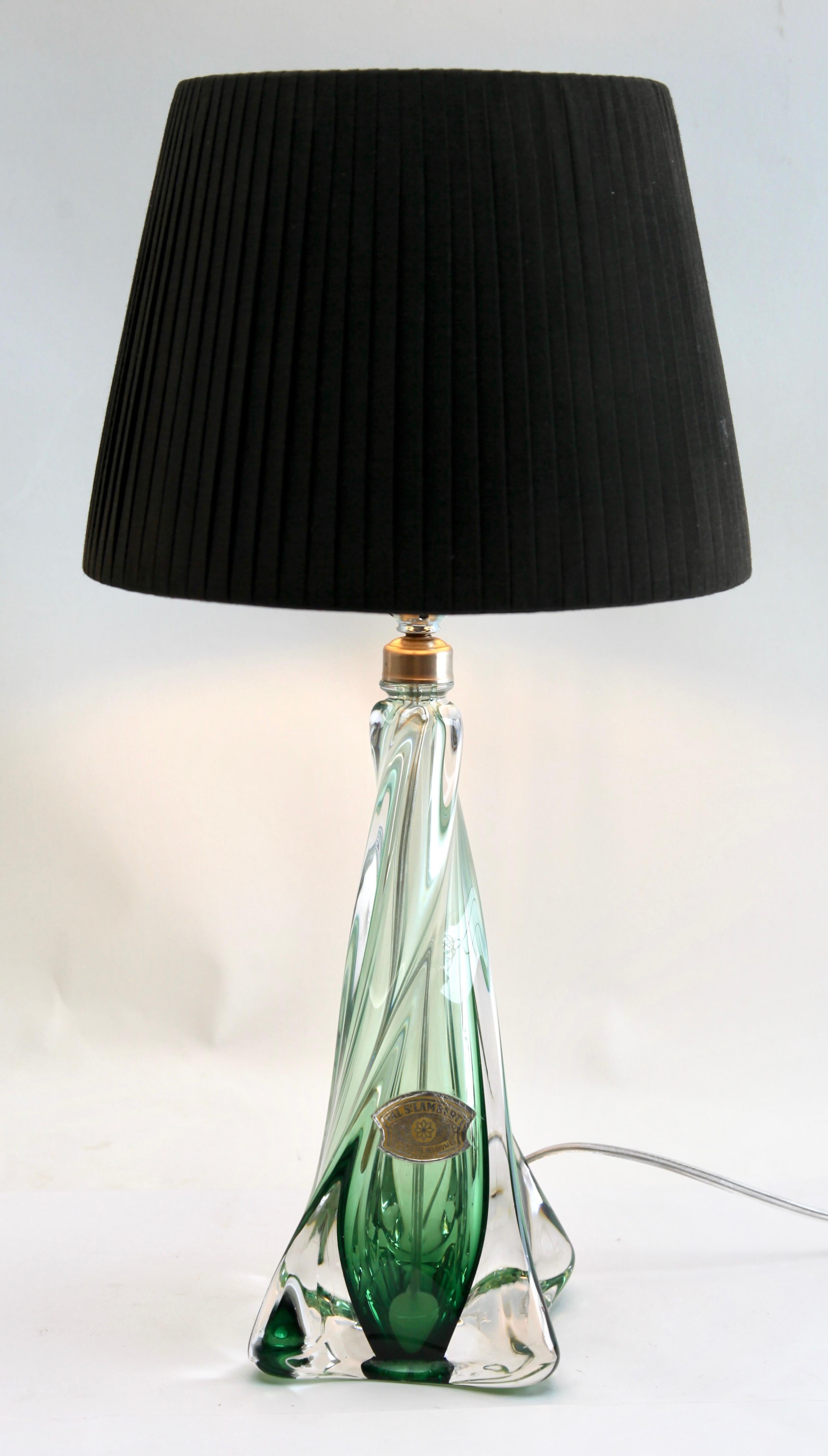 Pair Val Saint Lambert
This simple yet graceful green table lamp is in medium size: 13 inches excluding the lamp-fitting and shade. The colored core in Classic Val Saint Lambert tint has been given a thick Sommerso (clear crystal casing) so that