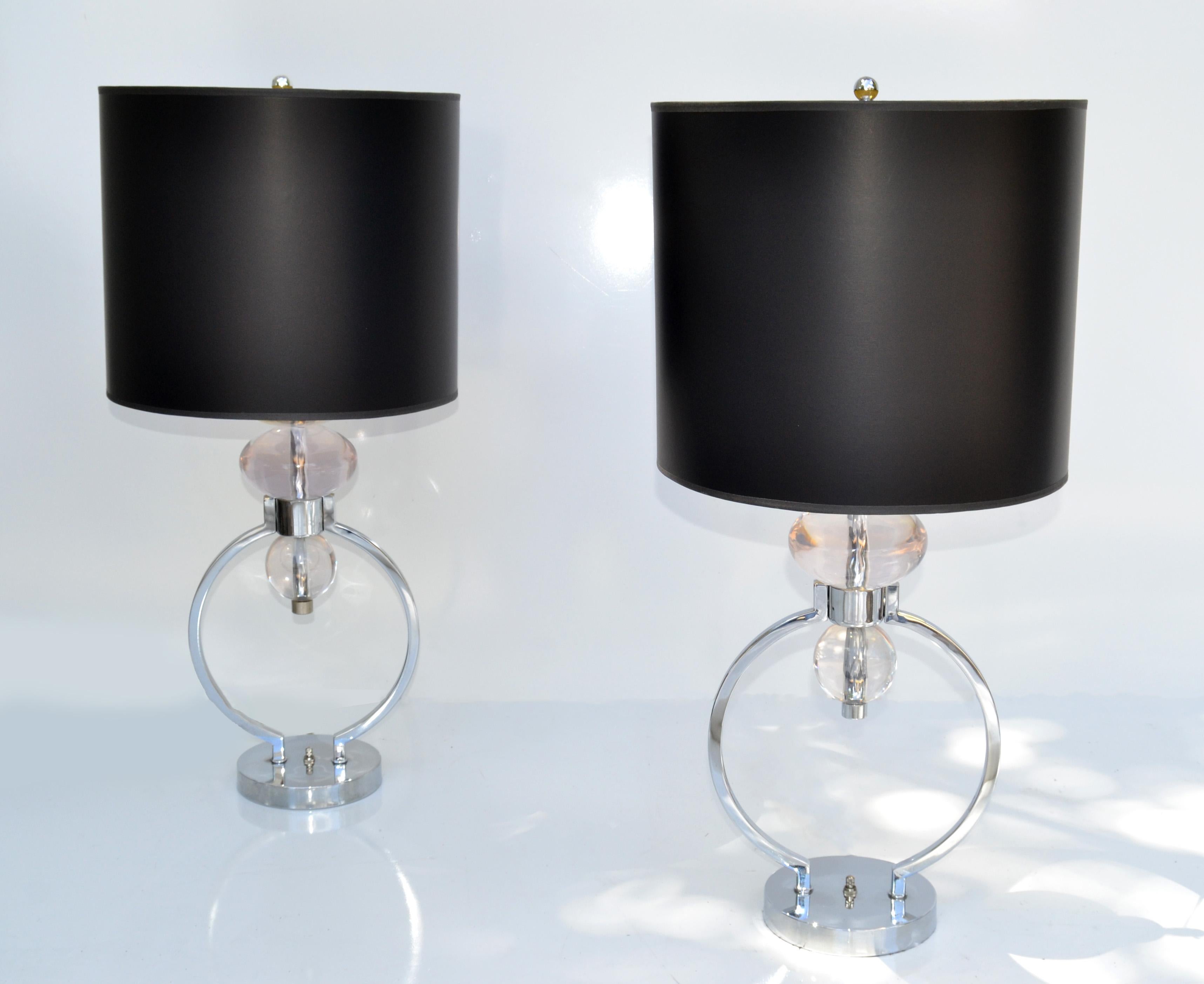 Pair of Van Teal Mid-Century Modern transparent geometric shaped Lucite pieces stacked table lamps with circle Chrome Core.
Come with harps and black & gold paper drum shades.
US wired, UL Listed and in working condition takes 1 regular Light Bulb