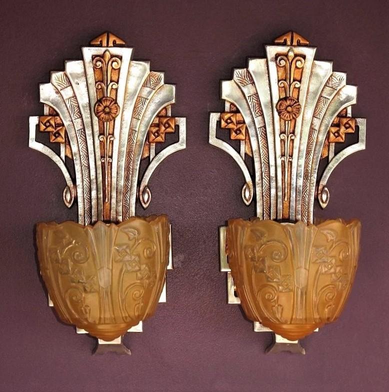 This pair of spectacular late 20s to early 30s slip shade wall sconces have been restored to their original glory of highly polished aluminum against a backdrop of Sunset Golden. Manufactured and signed by Lincoln. Dripping with original Art Deco